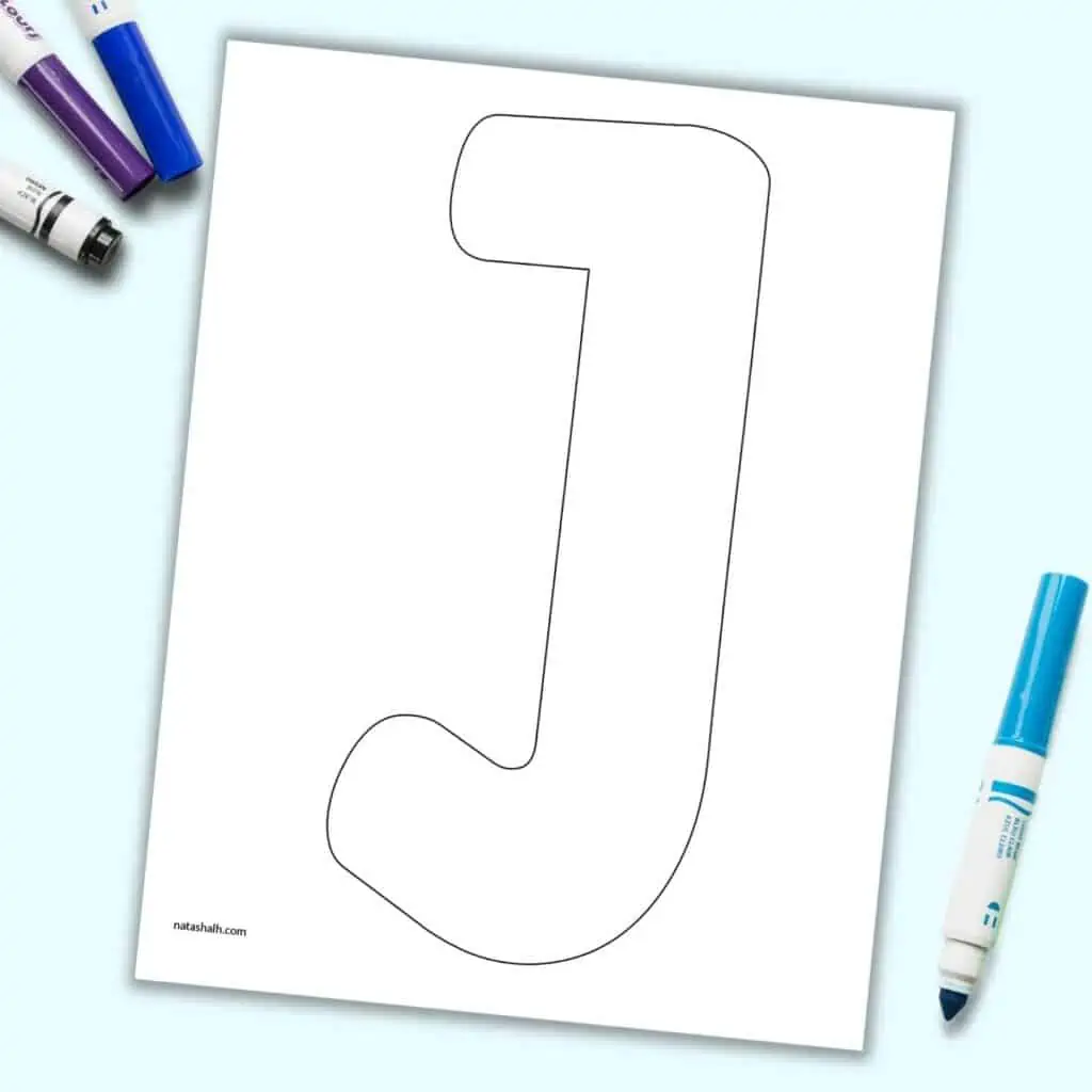 A printable uppercase bubble letter J on a blue background with children's markers.