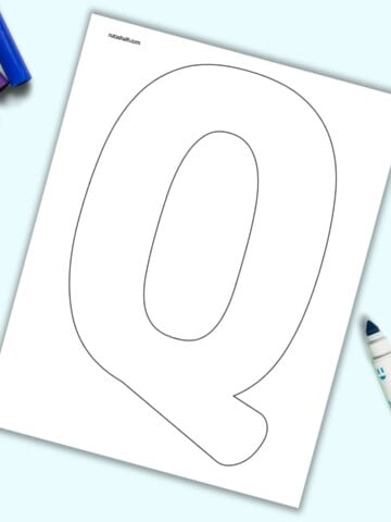 A page with a large bubble letter Q. It is shown on a light blue background with colorful children's markers.