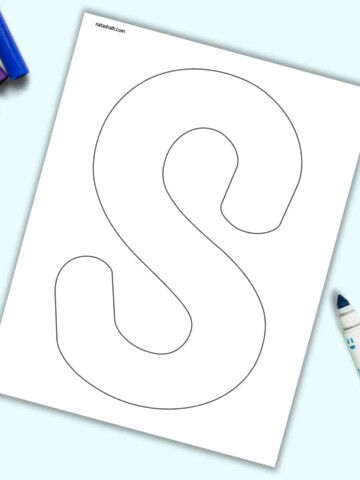 A page with a large bubble letter S. It is shown on a light blue background with colorful children's markers.