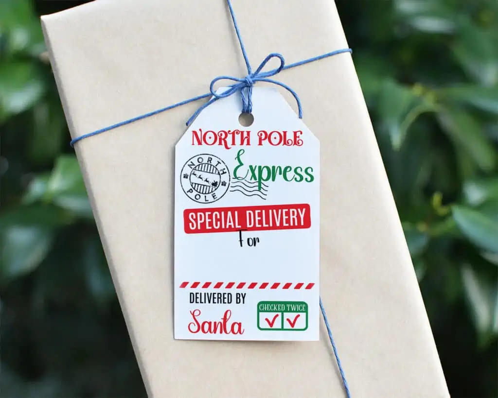 A "North Pole Express" Santa gift tag on a brown paper wrapped present