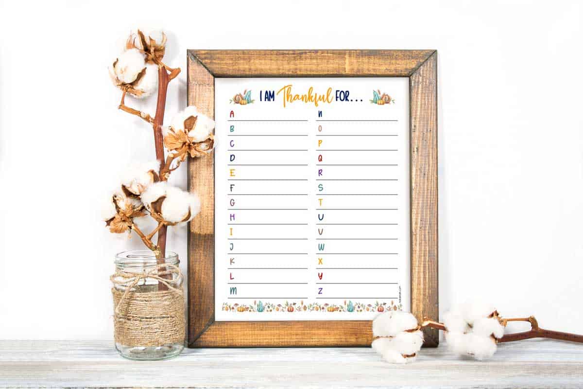 A Thanksgiving gratitude worksheet in a wood frame