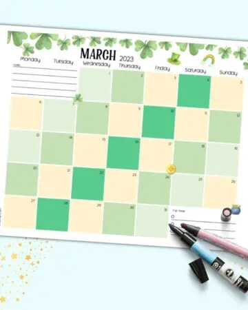 A preview of a March 2023 dated calendar page with shamrocks and a green and gold theme