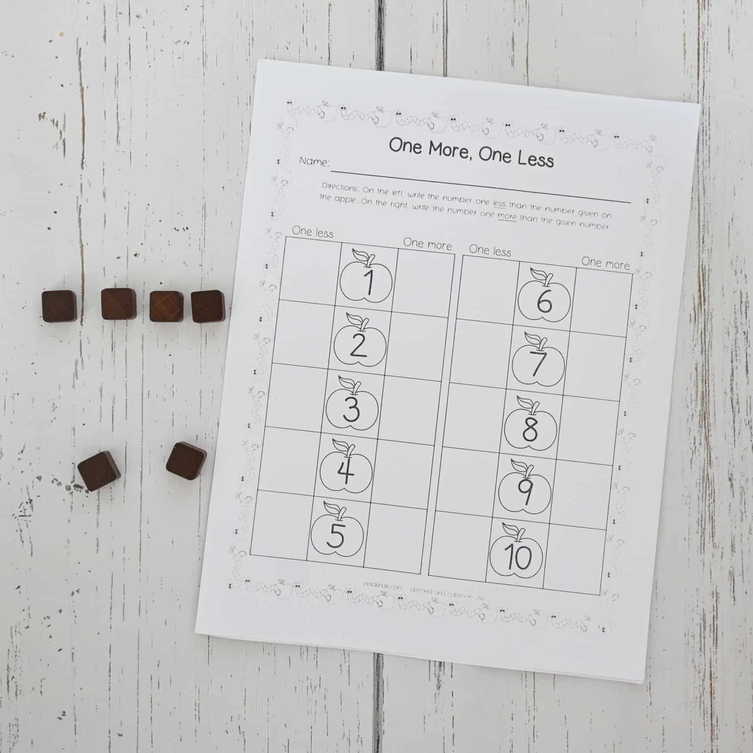 A printed one more, one less worksheet with square counting manipulatives