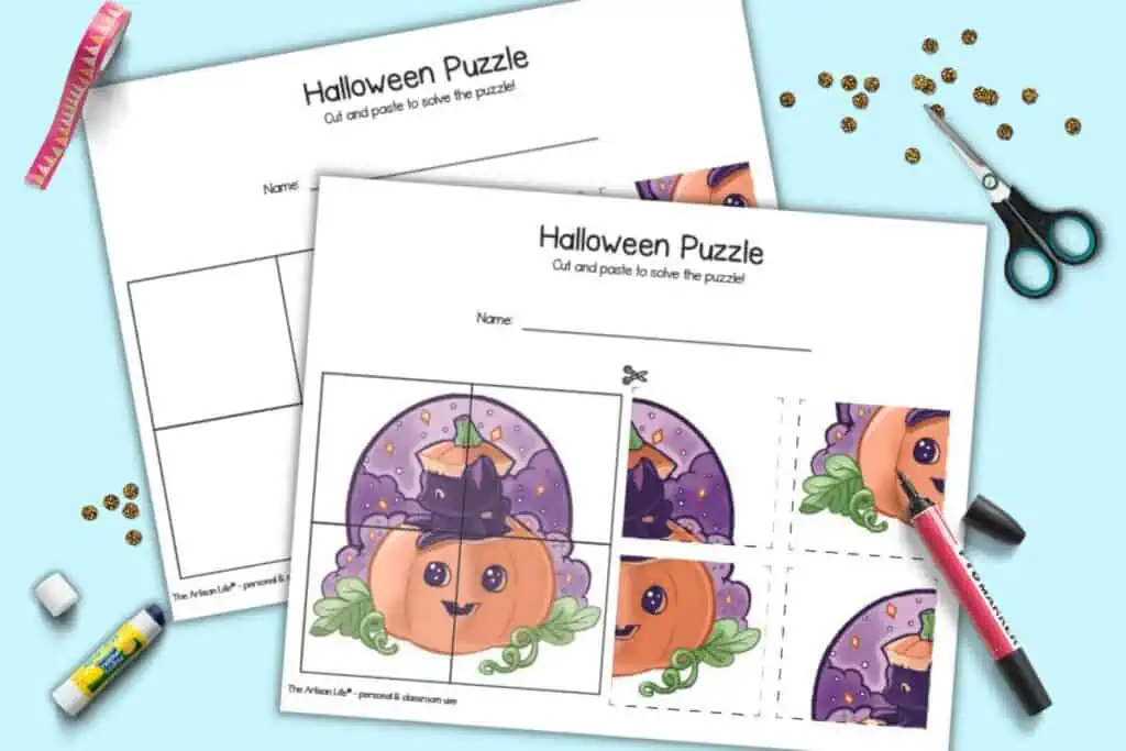 A preview of two printable Halloween cut and paste puzzles. Both puzzle show the same image of a cute black cat and a jack o lantern. One puzzle has a hint image and the other has a blank grid to paste the pieces onto. The pages are shown with a red marker, a pair of scissors, and a roll of tape.