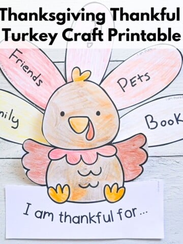 Text overlay "Thanksgiving thankful turkey craft printable" over a picture of a colored and completed thankful turkey craft