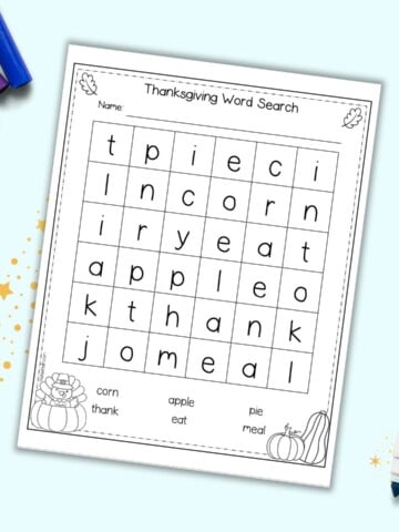 A preview of an easy Thanksgiving themed word search for kindergartners. It is shown on a light blue background with four children's markers.