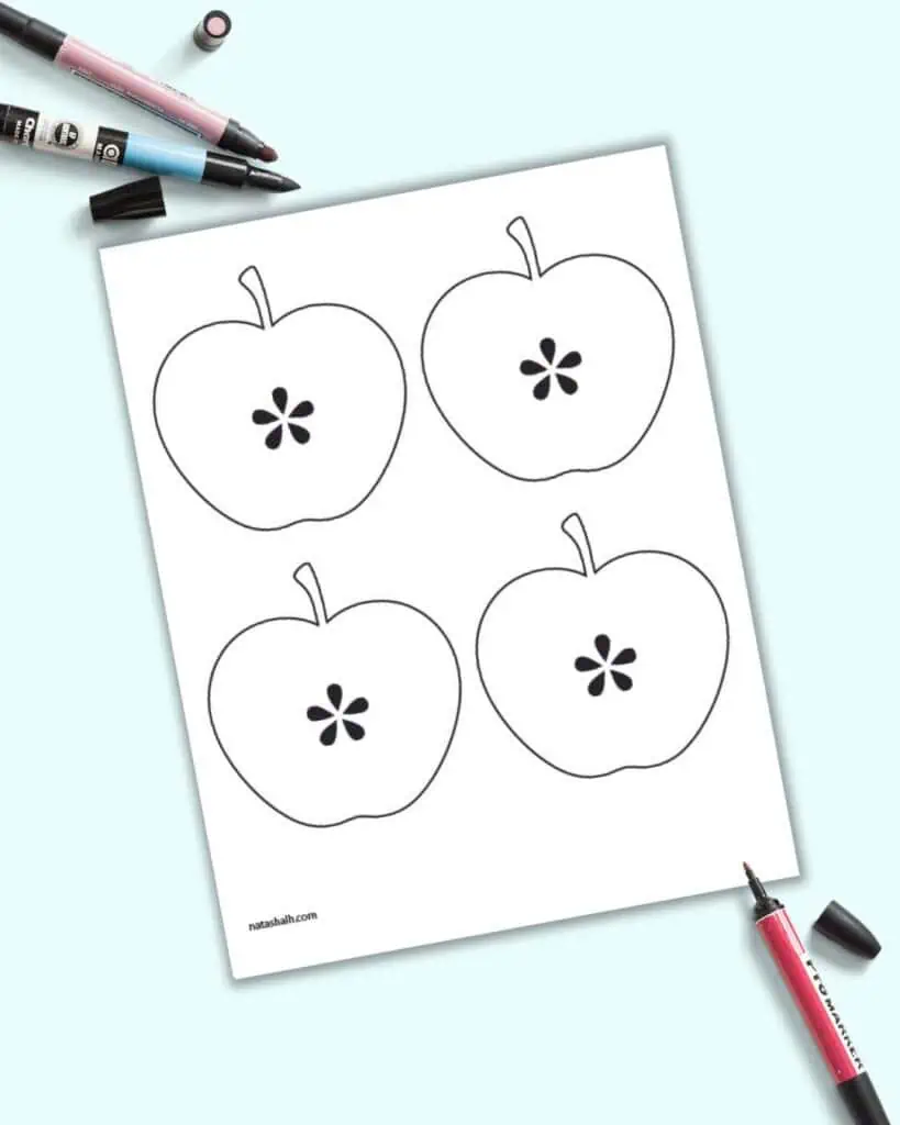A preview of four medium apple templates on one page.  Each apple is cut in half to reveal the seeds