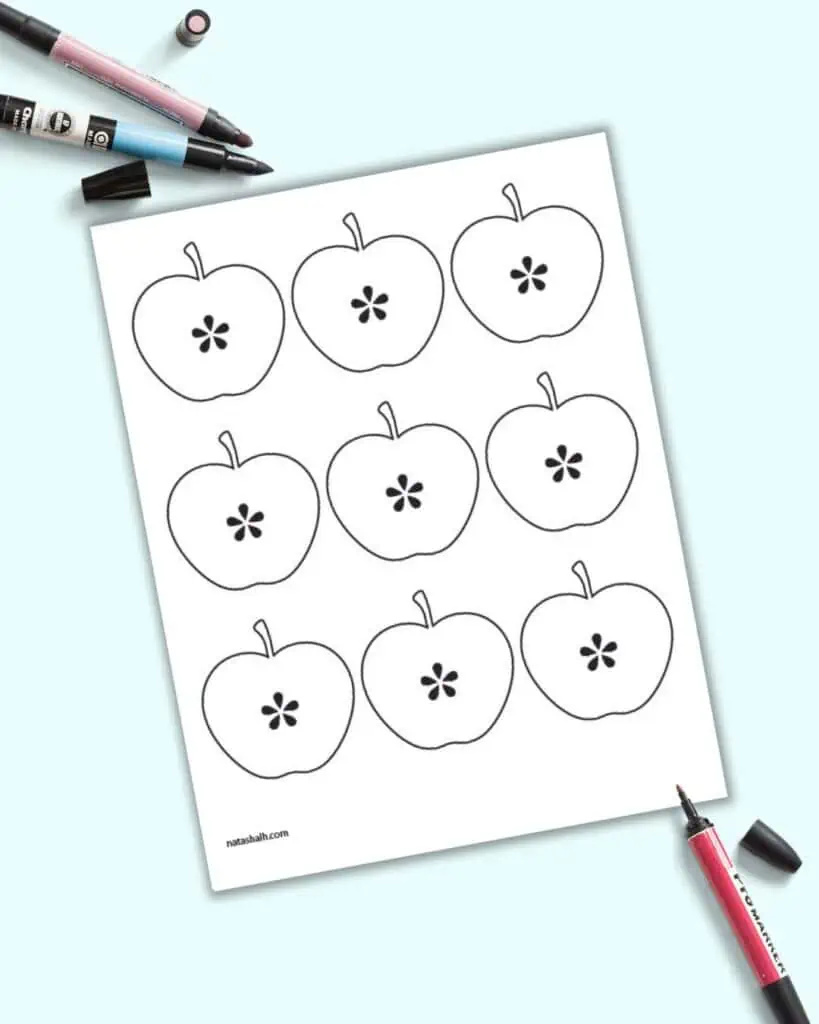 A preview of nine small apple templates on one page. Each apple is cut in half to show seeds