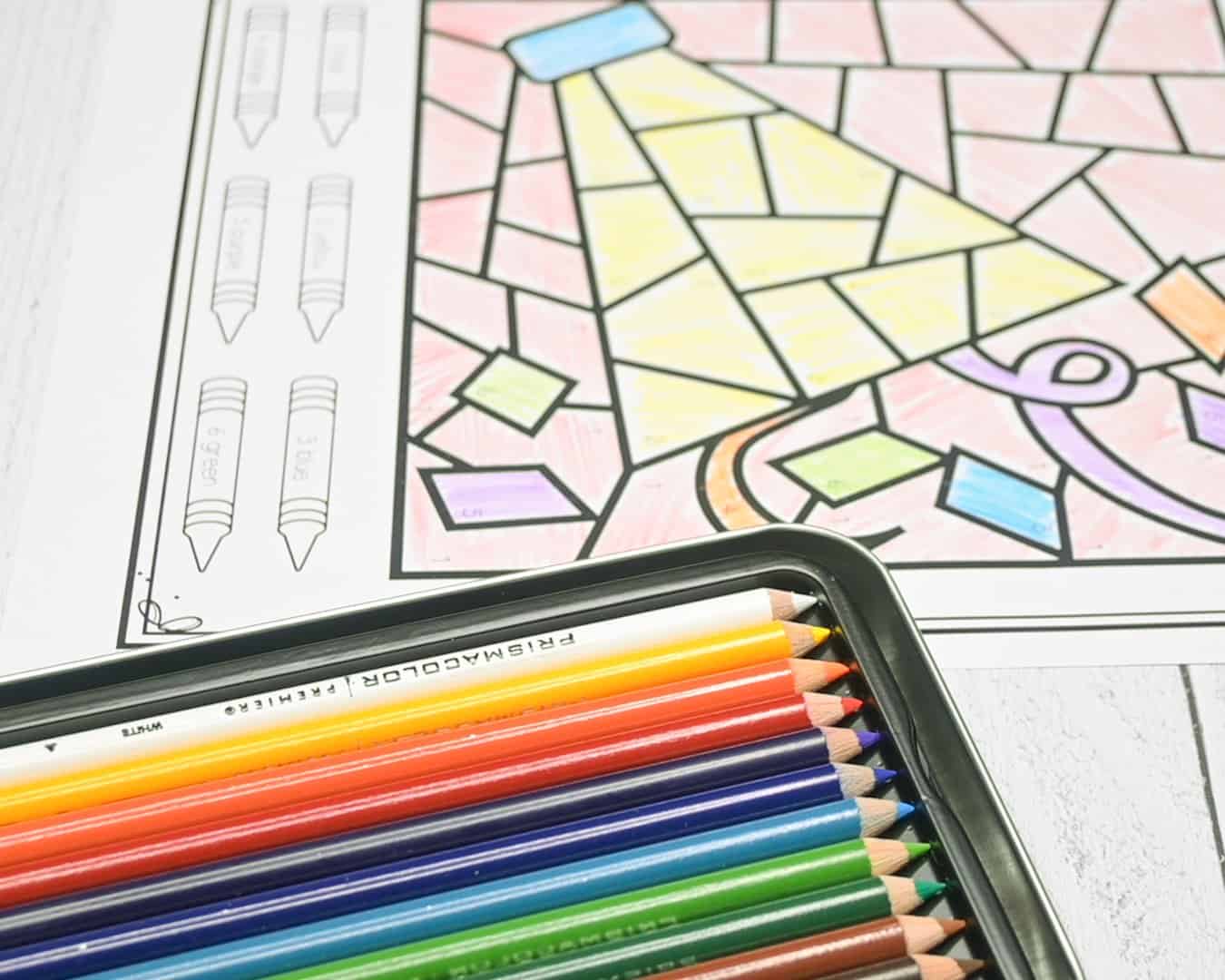 A photo of a colored party popper coloring page and Prismacolor coloring pencils 