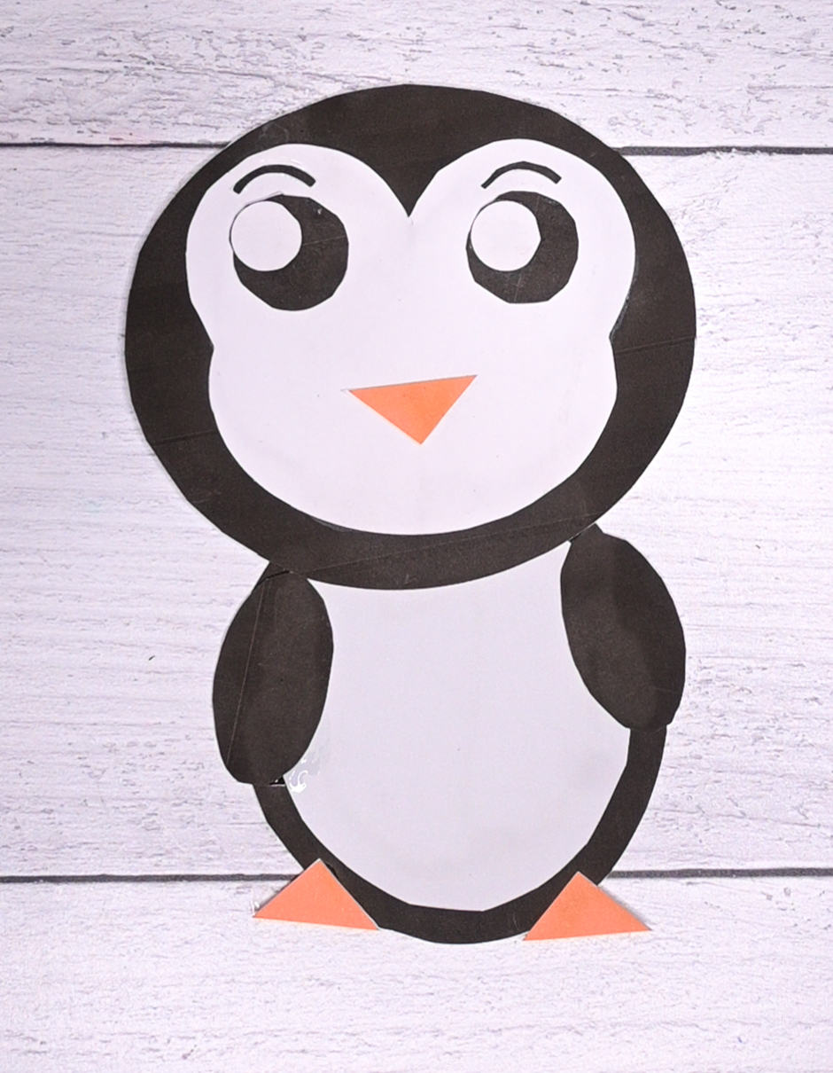 A top down photo of an assembled cut and paste penguin craft