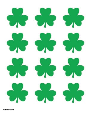 A preview of 12 small shamrock printable templates in green