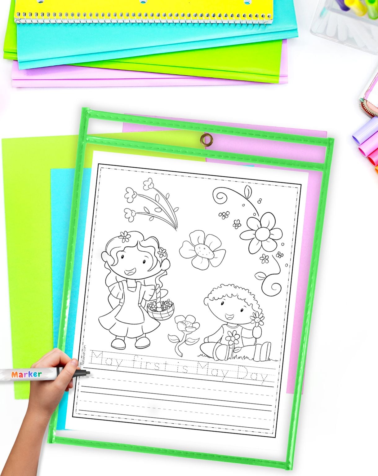 a child using a May Day tracing worksheet in a dry erase pocket