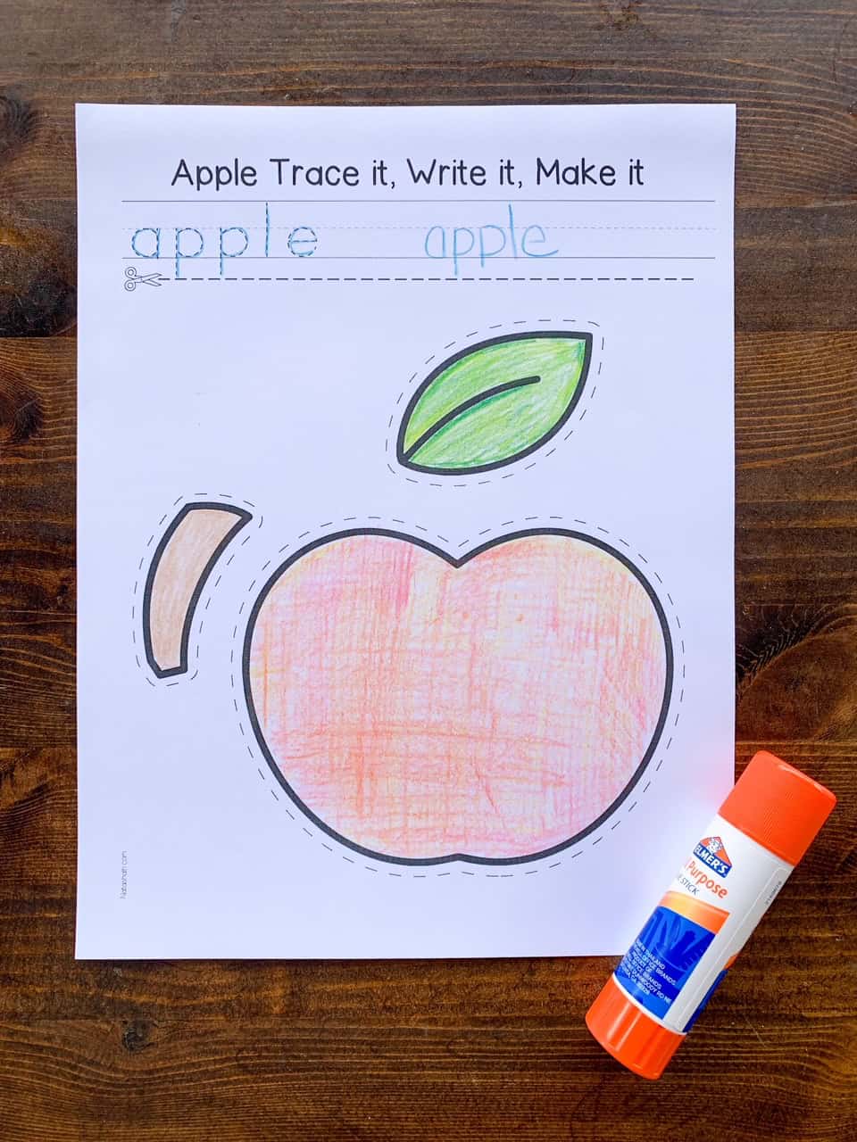 A photo of a colored but not cut out apple craft