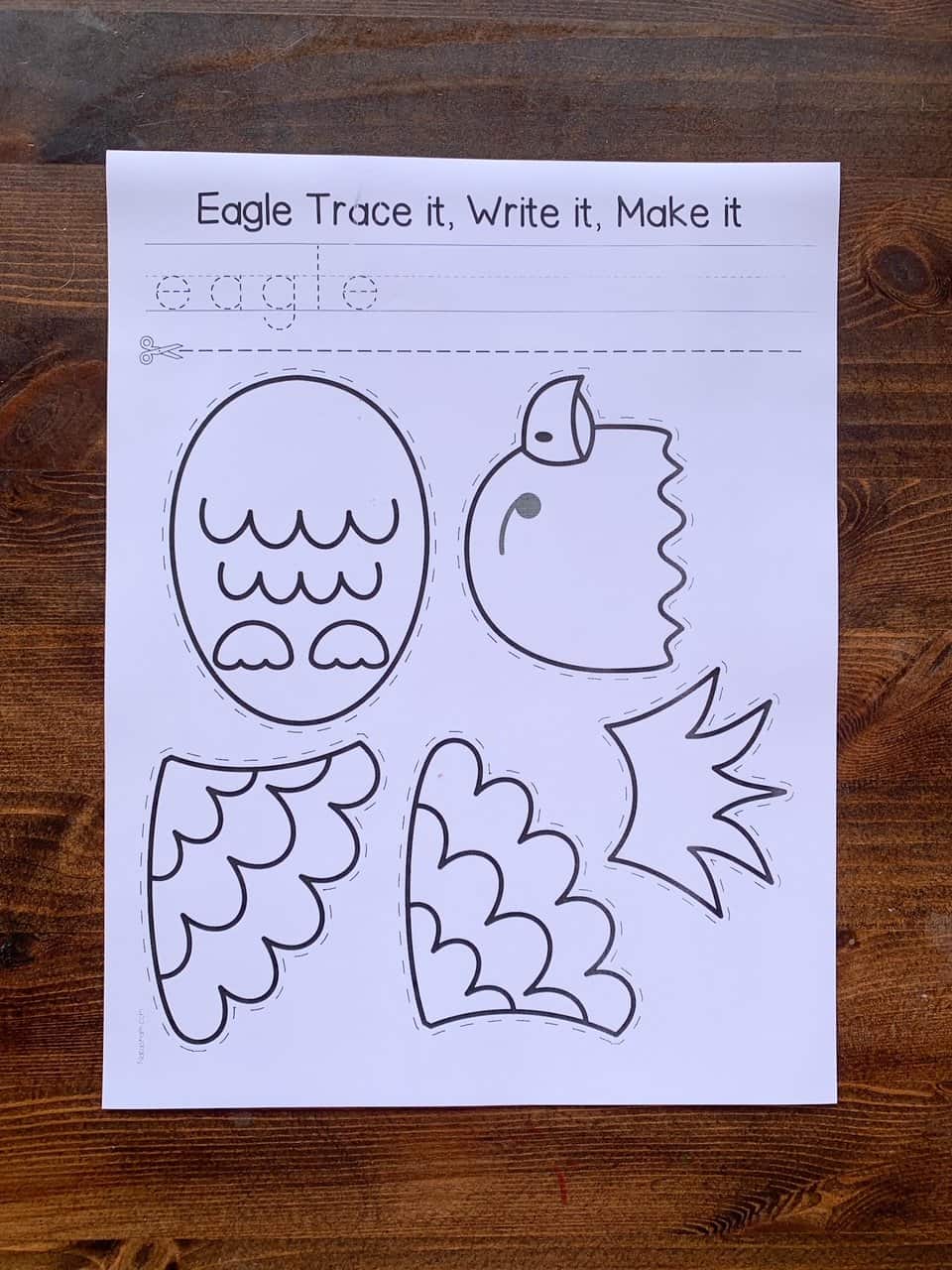 A top down photo of a black and white cut and paste eagle craft