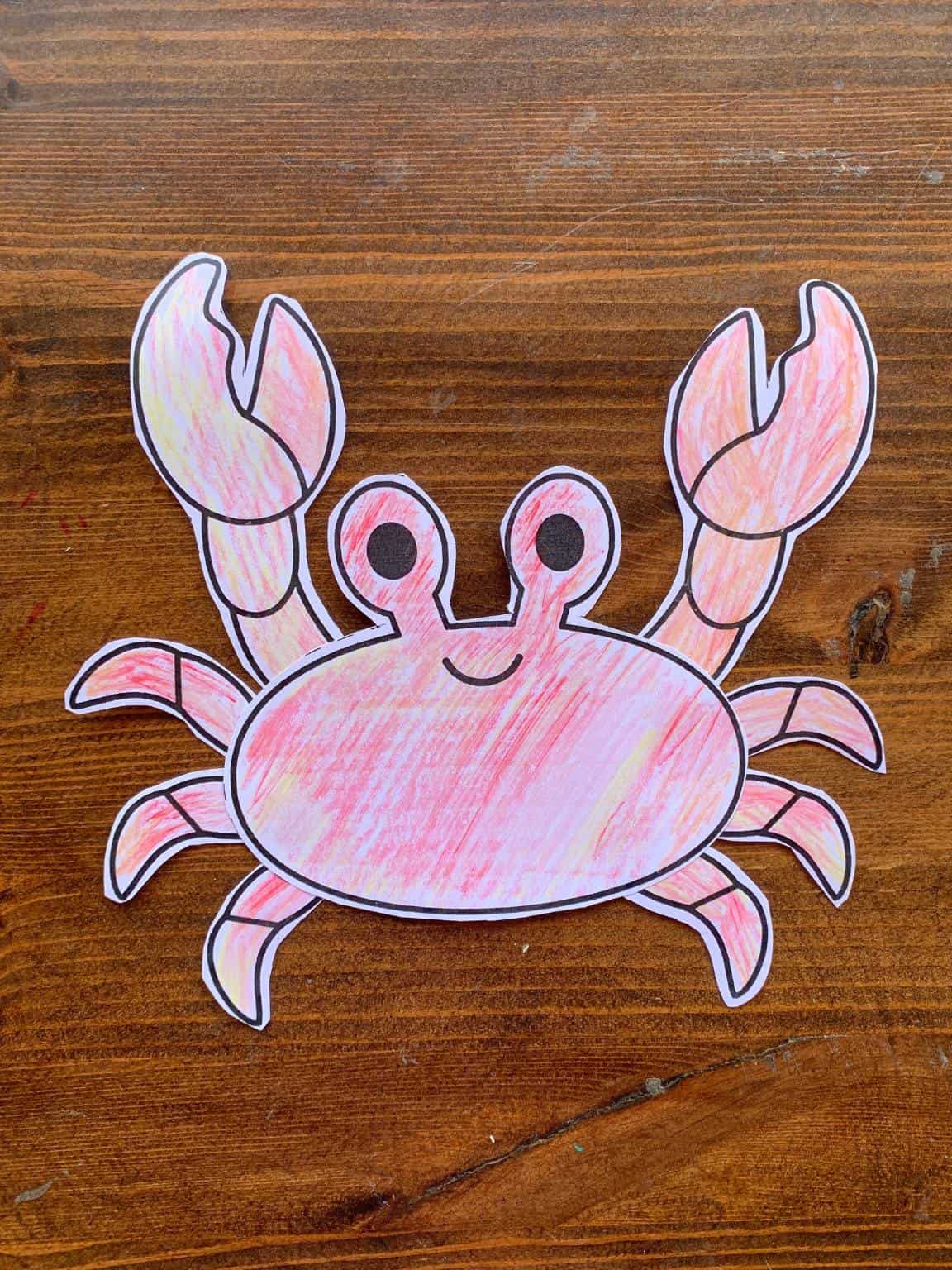 A completed cut and paste crab craft for kids