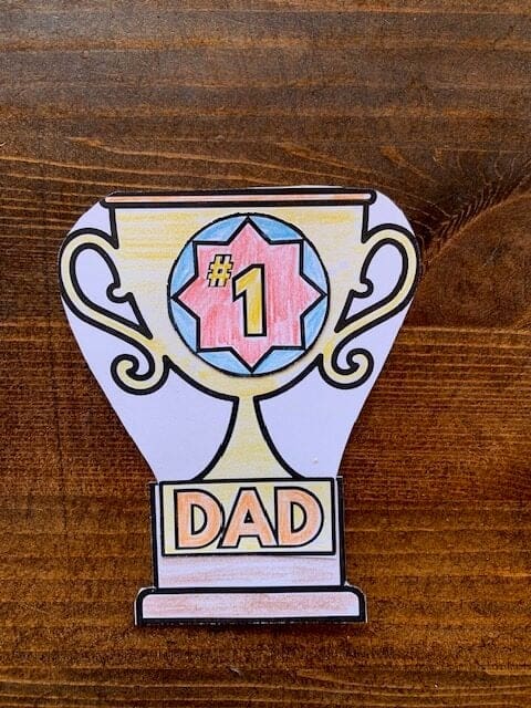 A cut and paste paper trophy with "#1 Dad"