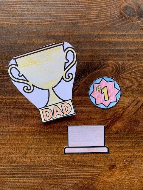 Three pieces to make a paper cut and paste trophy for Father's Day 