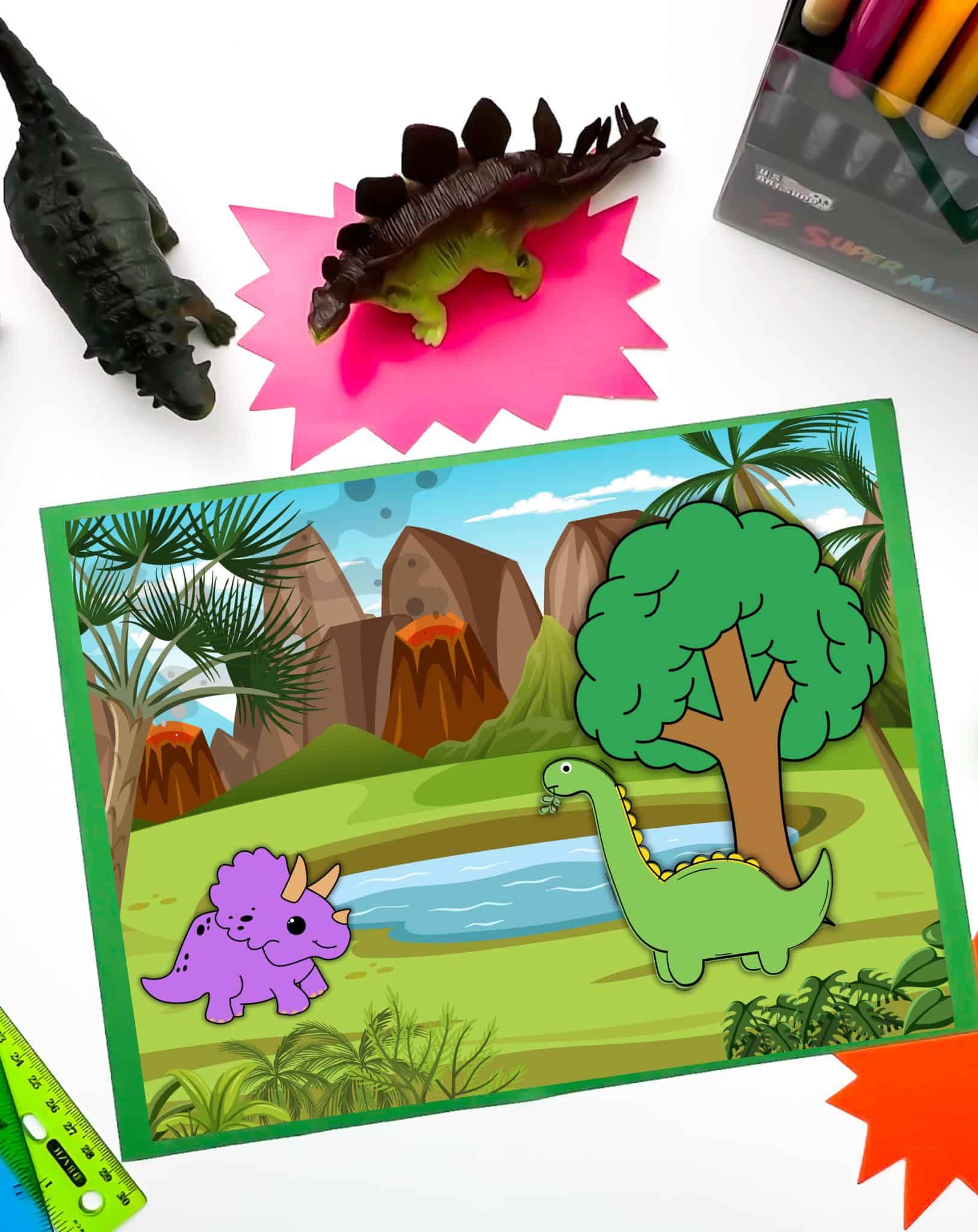 A top down photo of a dinosaur diorama being used as a playmate with two Dinos and a tree