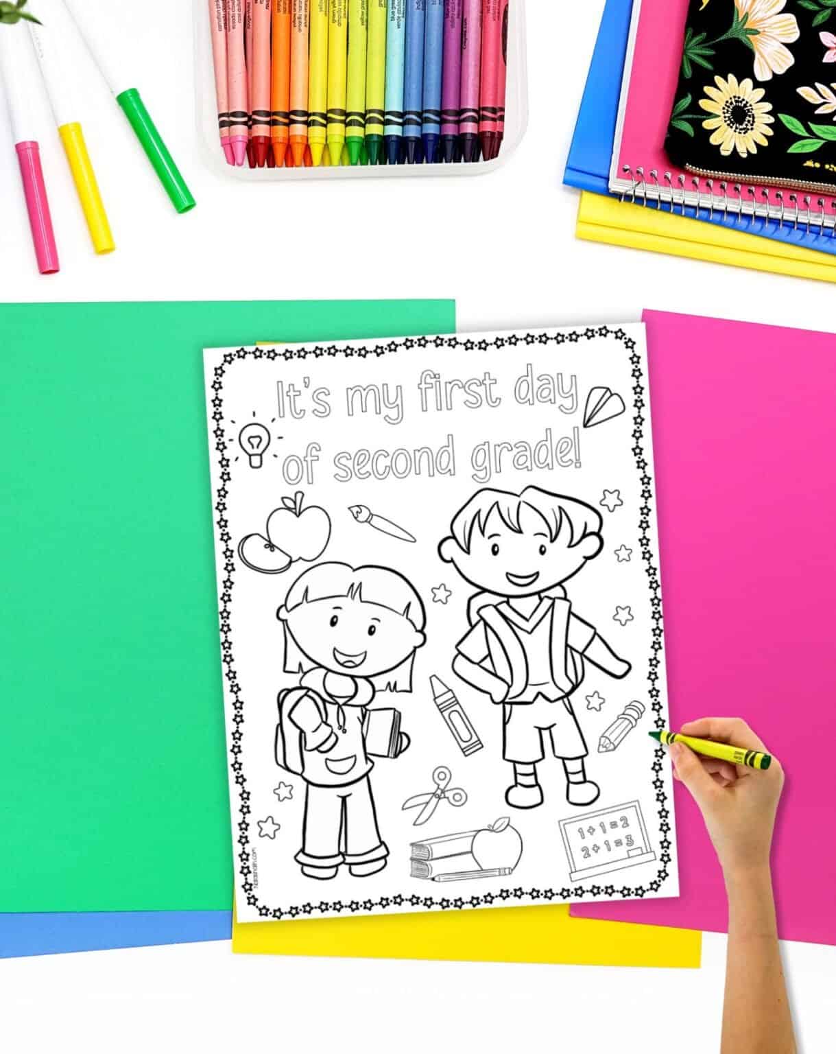 A top down image of a coloring page with the caption "it's my first day of second grade!" and two kids wearing backpacks