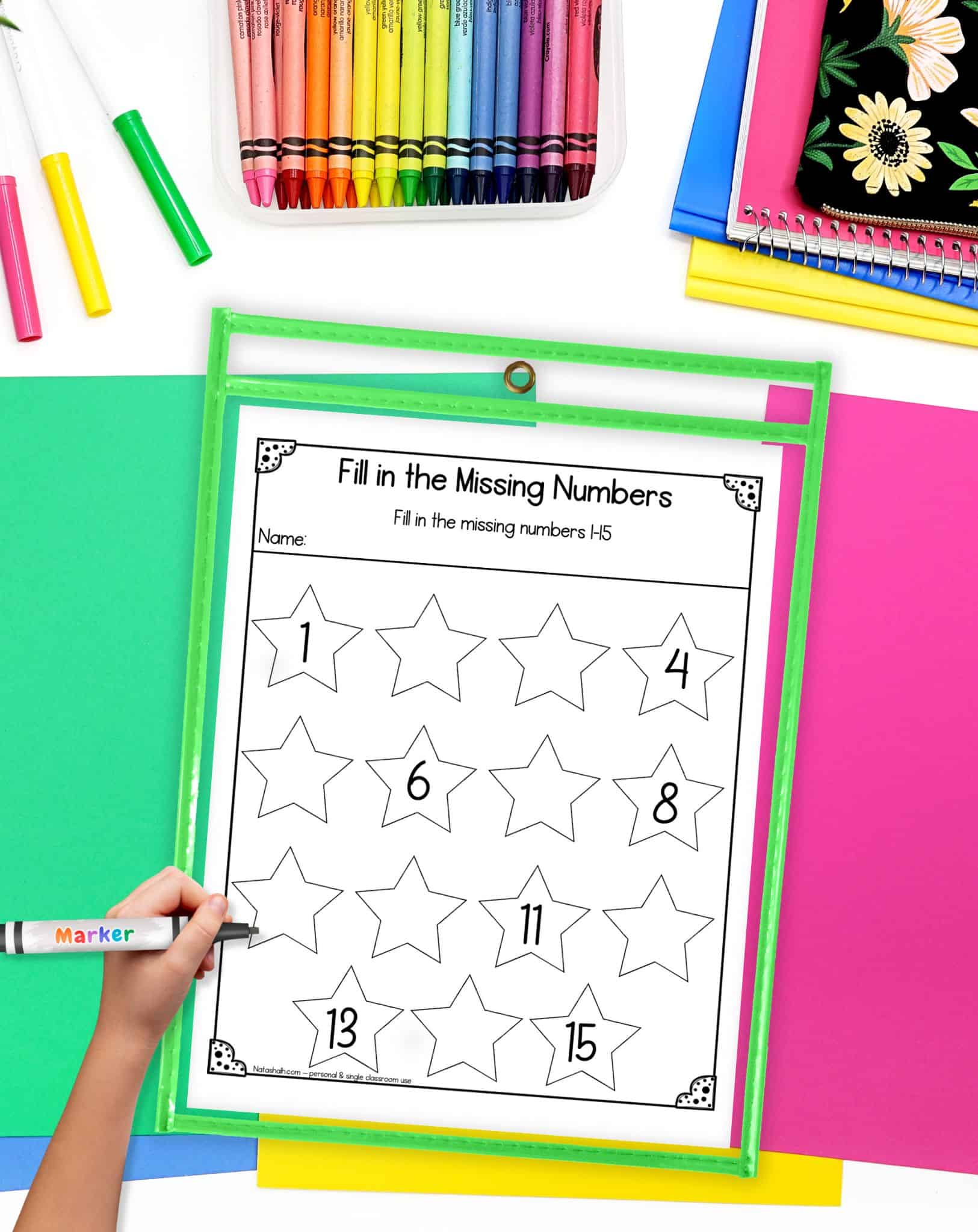 A missing number worksheet with numbers 1-15 in a dry erase pocket