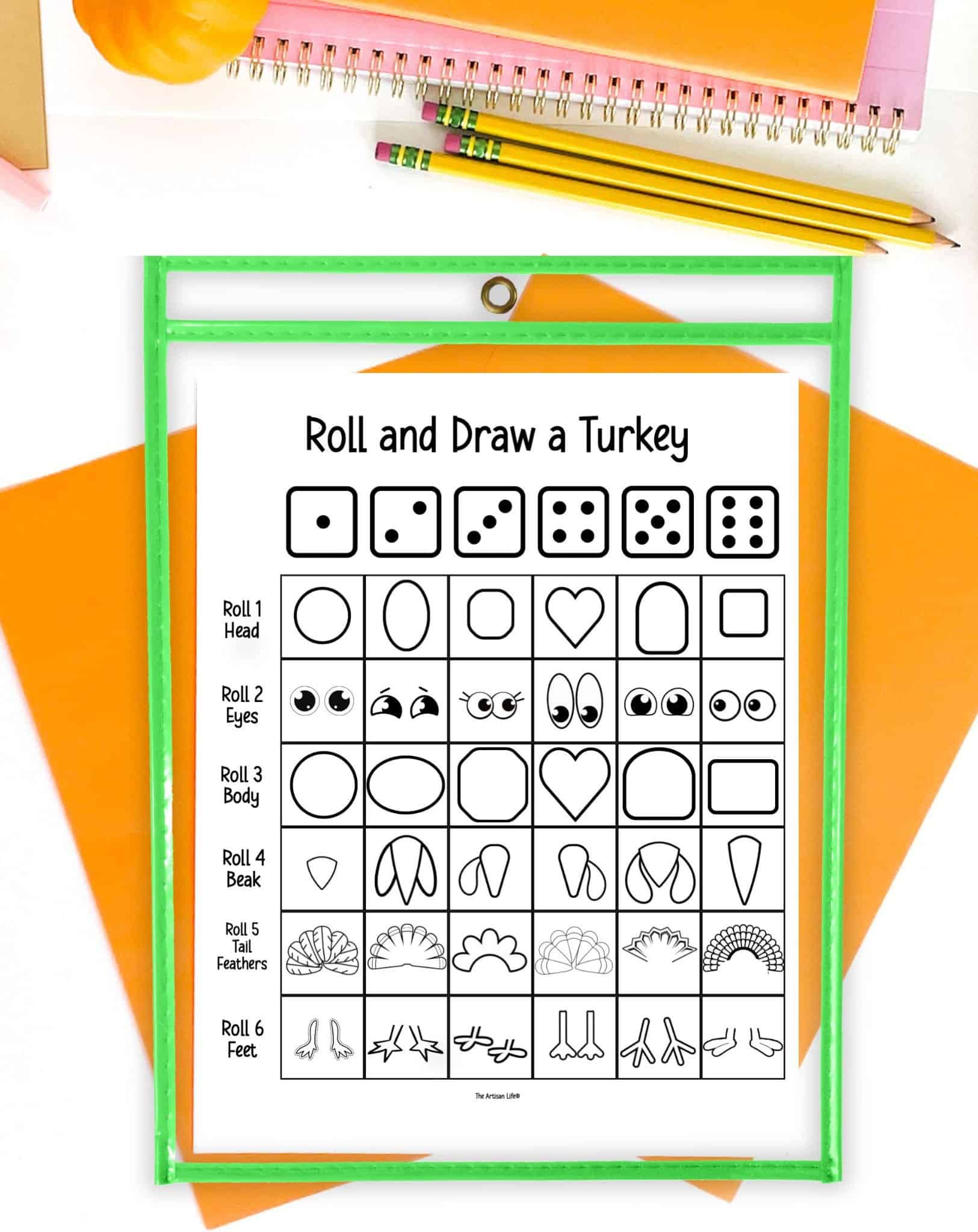 The instructions sheet for a roll and draw a turkey printable in a dry erase pocket on a table with orange papers