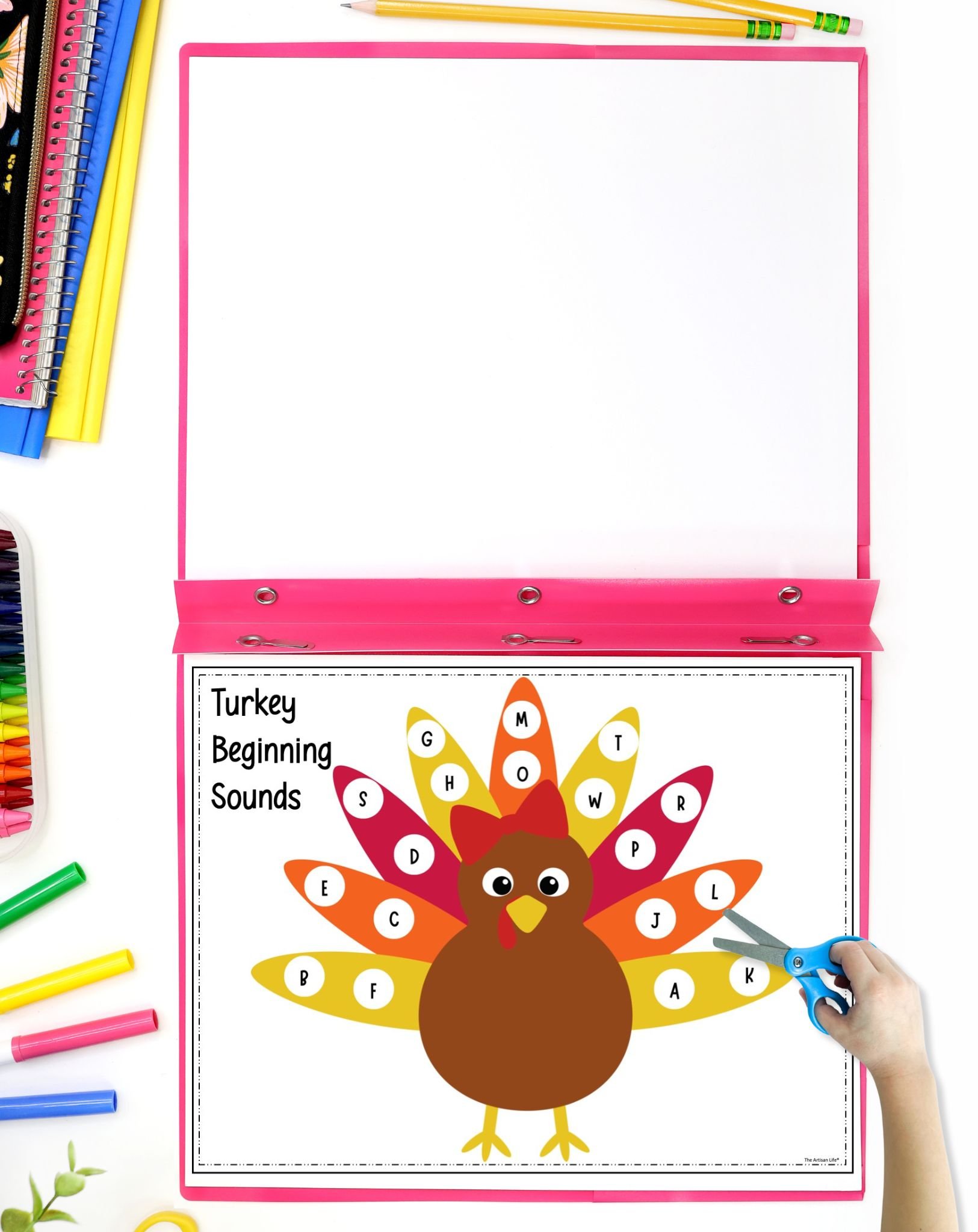 A beginning letter sounds turkey activity in a file folder on a desk