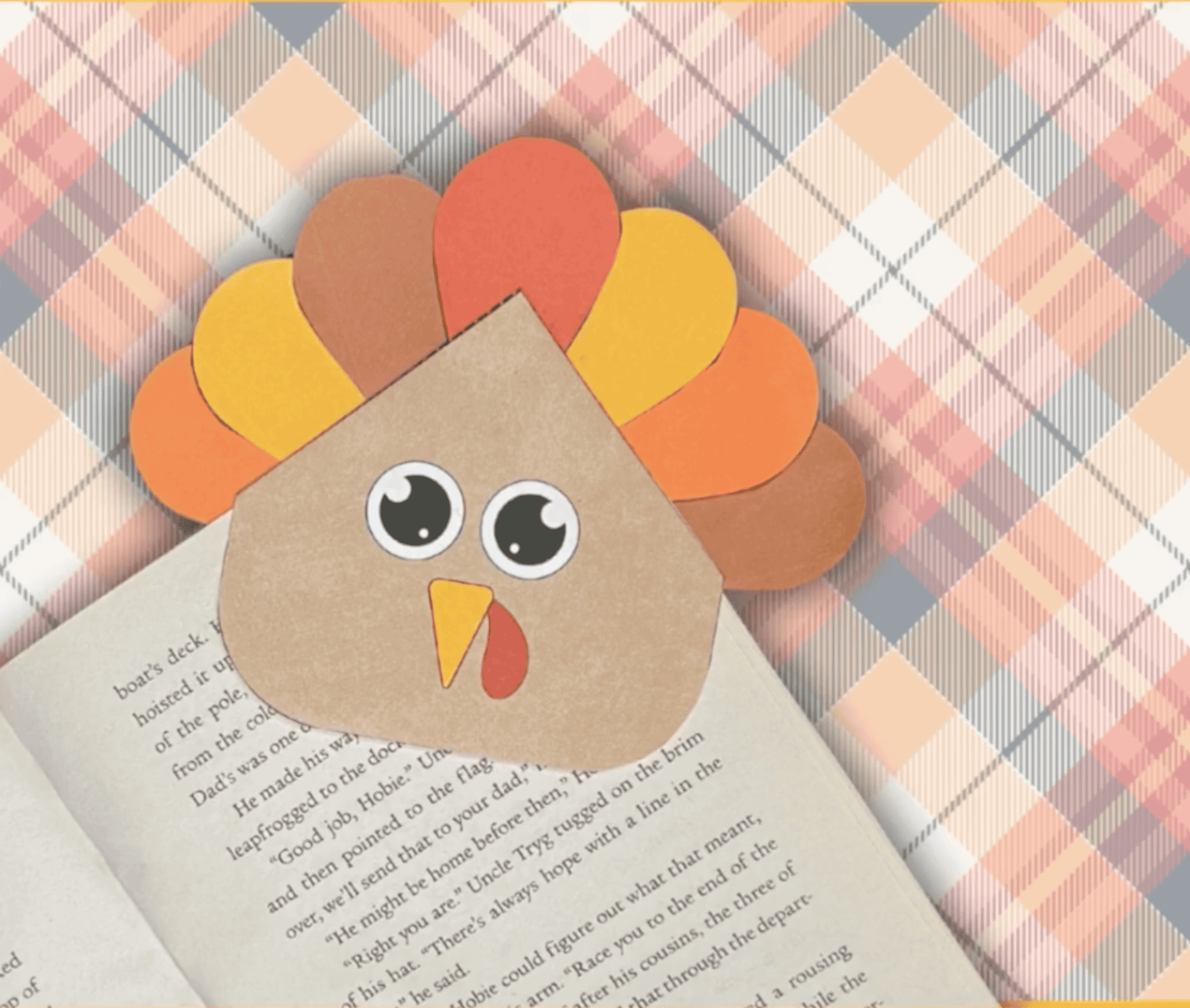 a completed turkey bookmark craft on a book