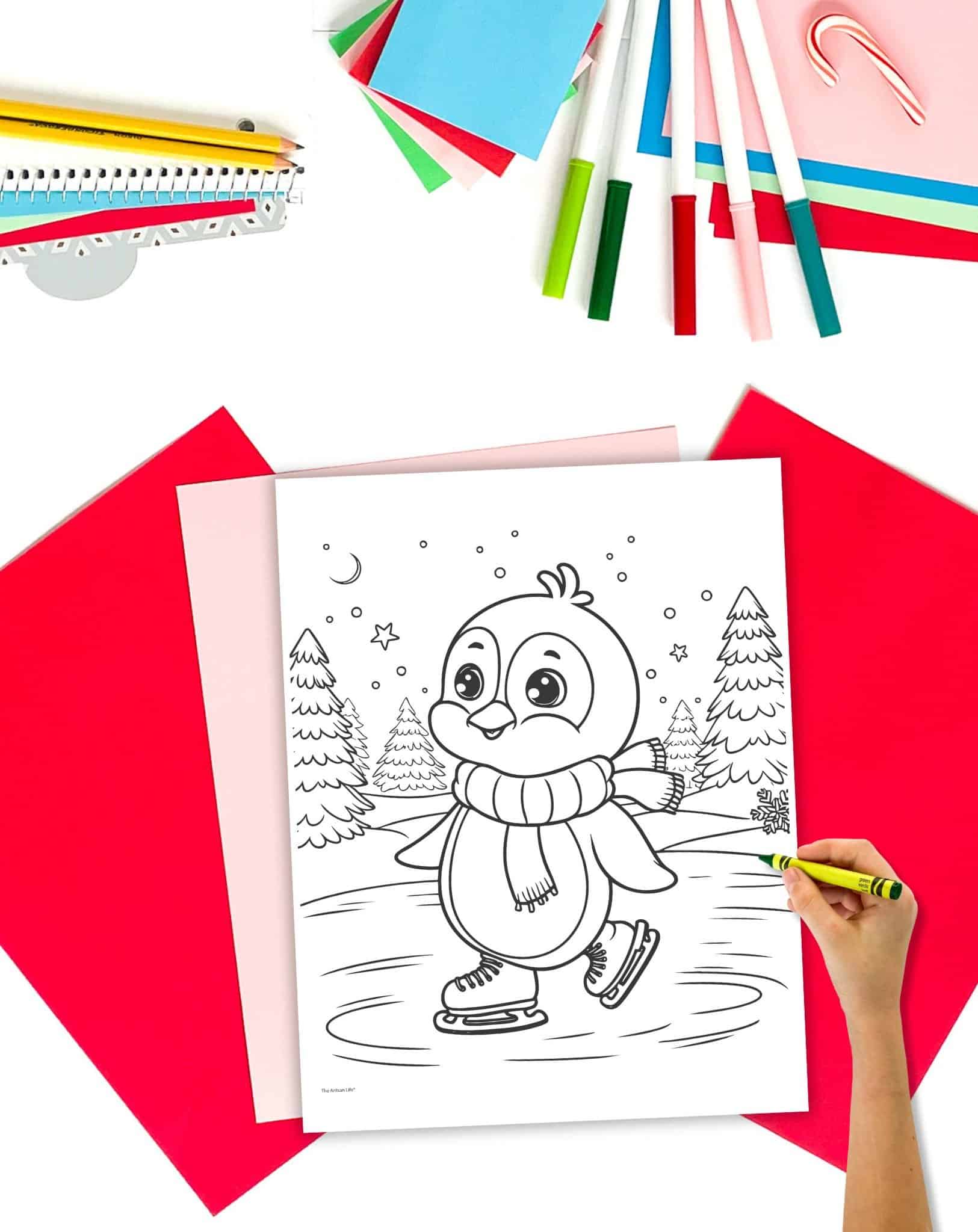 a child coloring a page showing an ice skating penguin