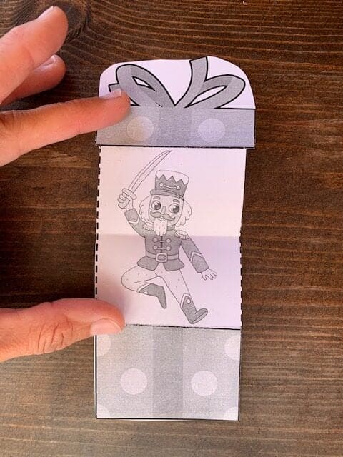 A completed Christmas surprise card with a nutcracker