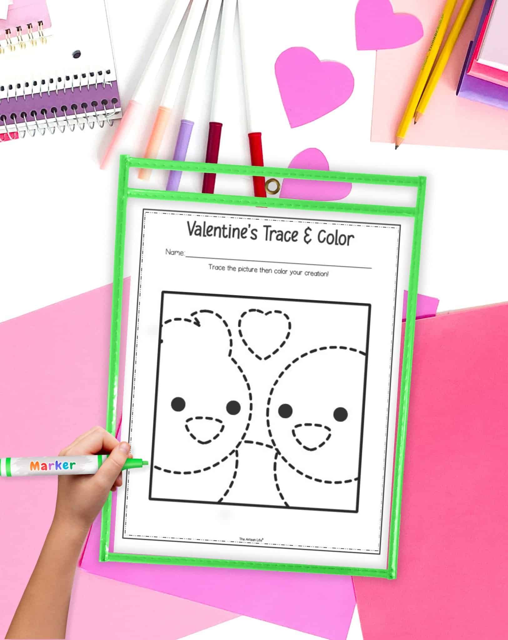 a Valentine's Day trace and color worksheet for preschoolers in a dry erase pocket