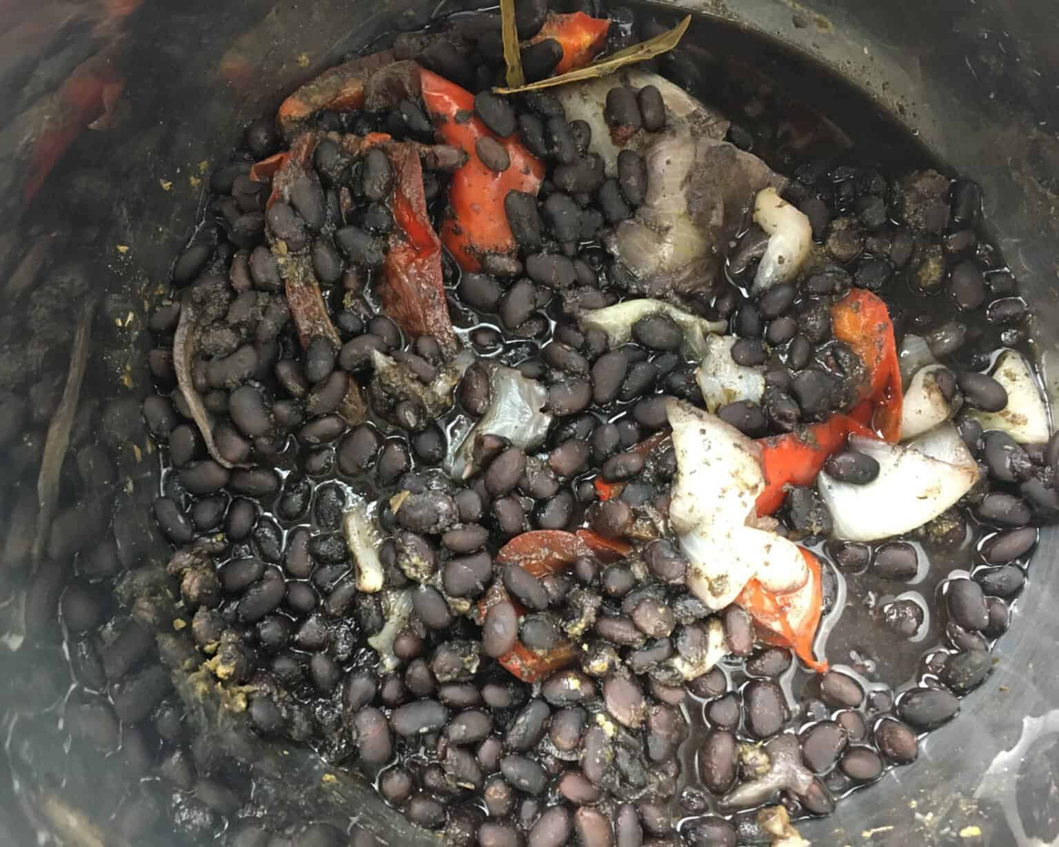 cooked black beans with onions and red peppers in an Instant Pot