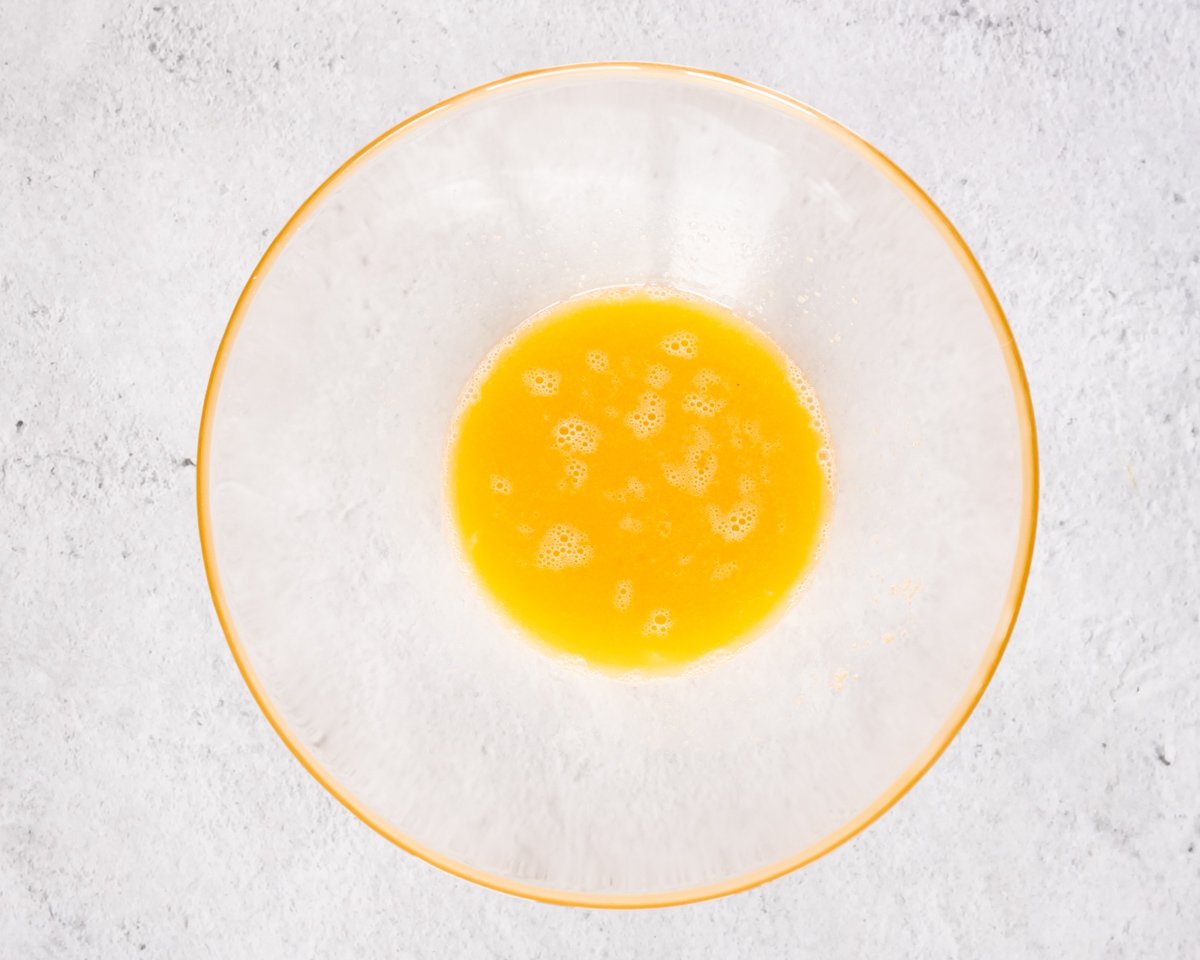 mixing eggs in a bowl for making gluten free pancakes