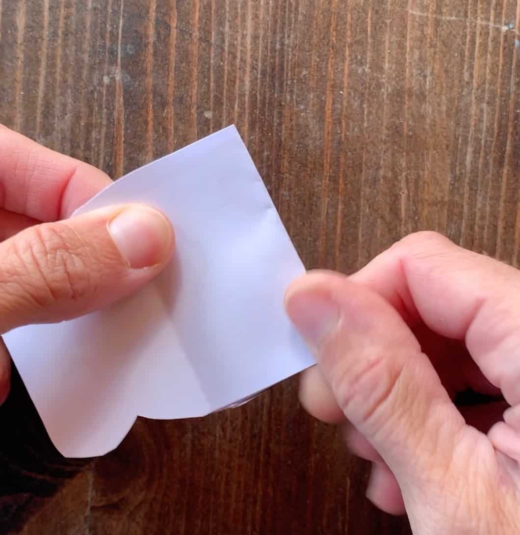 Folding a monster valentine with a crease at the back to make a mouth