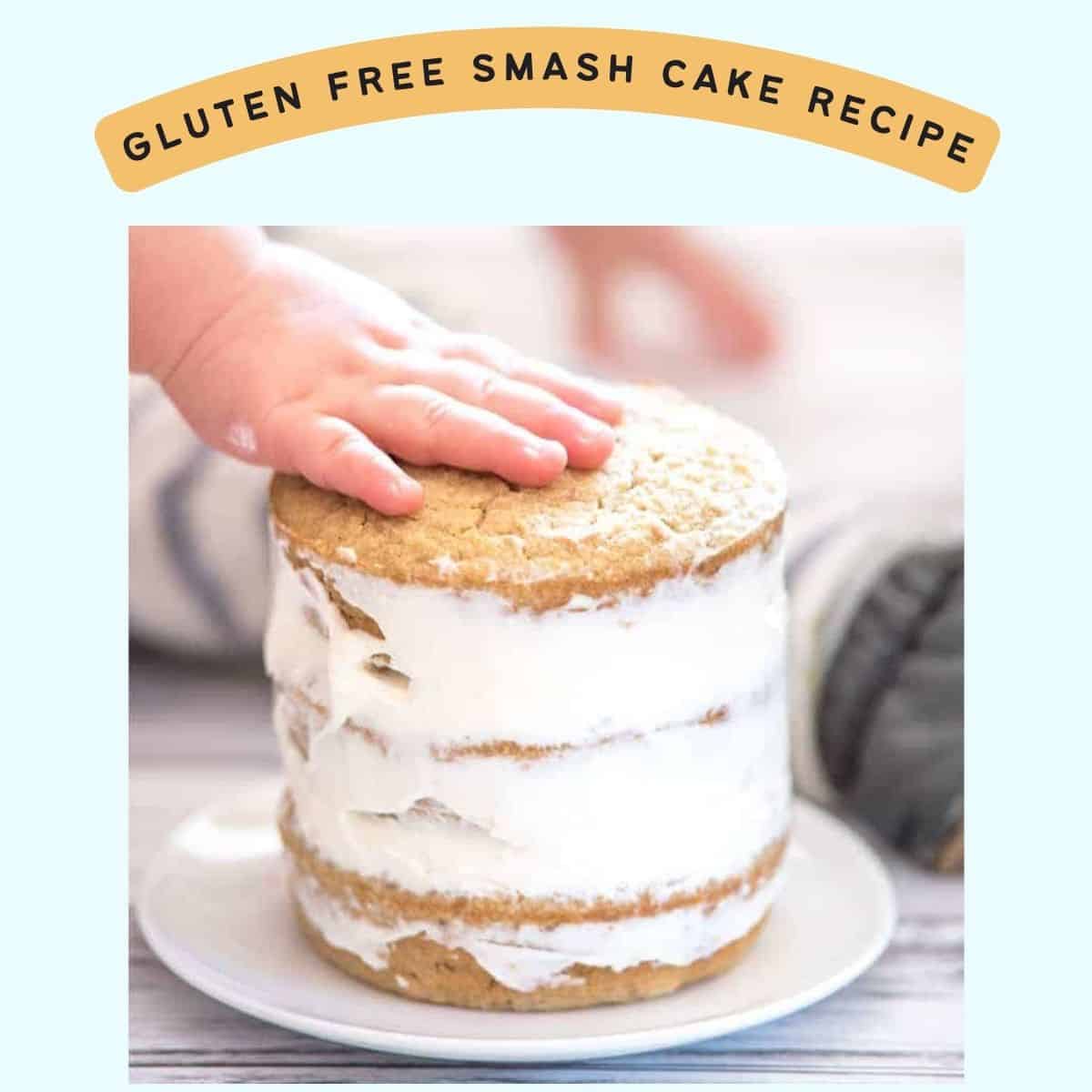 a toddler's hand on top of a small layer cake with the caption "gluten free smash cake recipe"