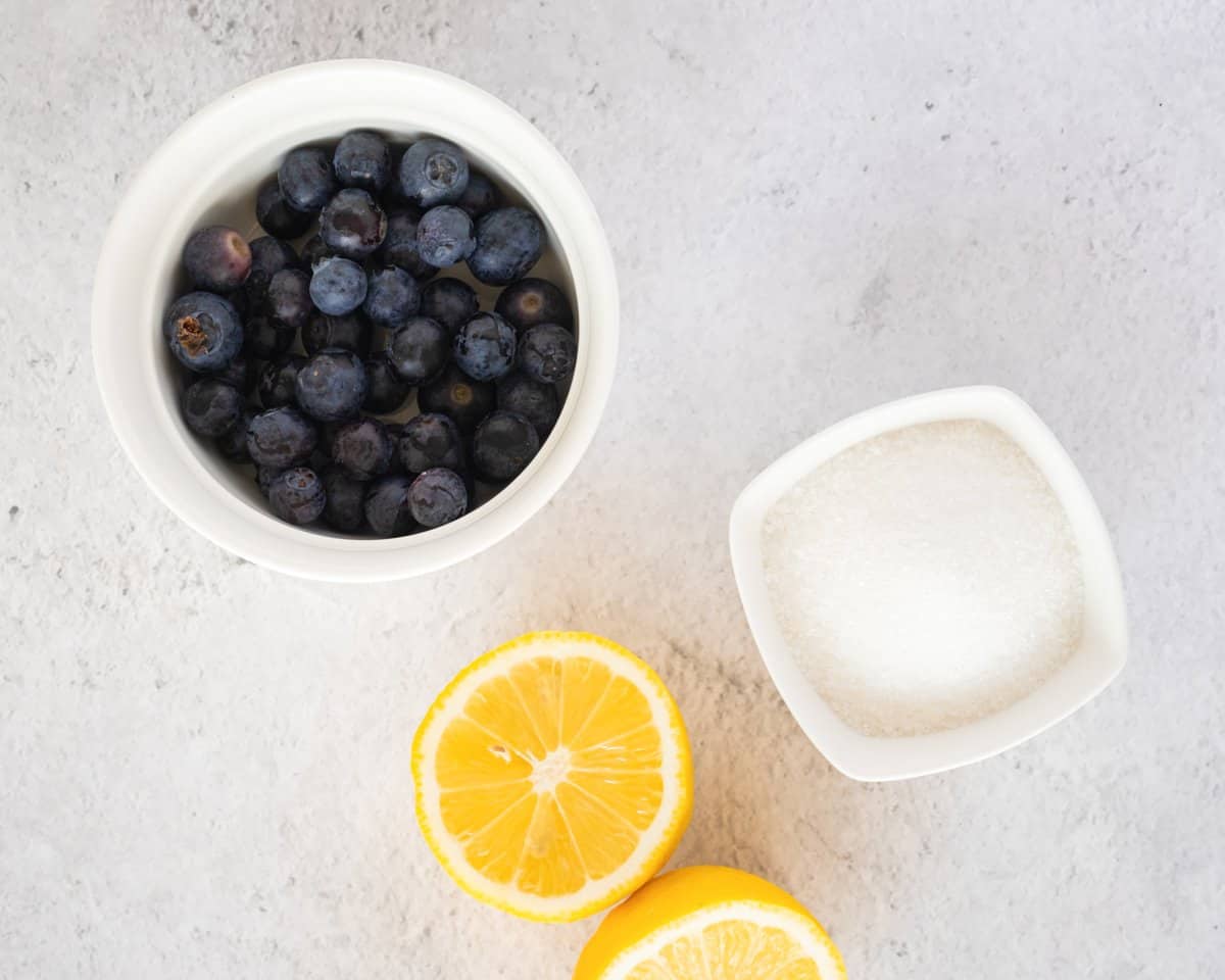 sugar, blueberries, and lemons for making blueberry jam