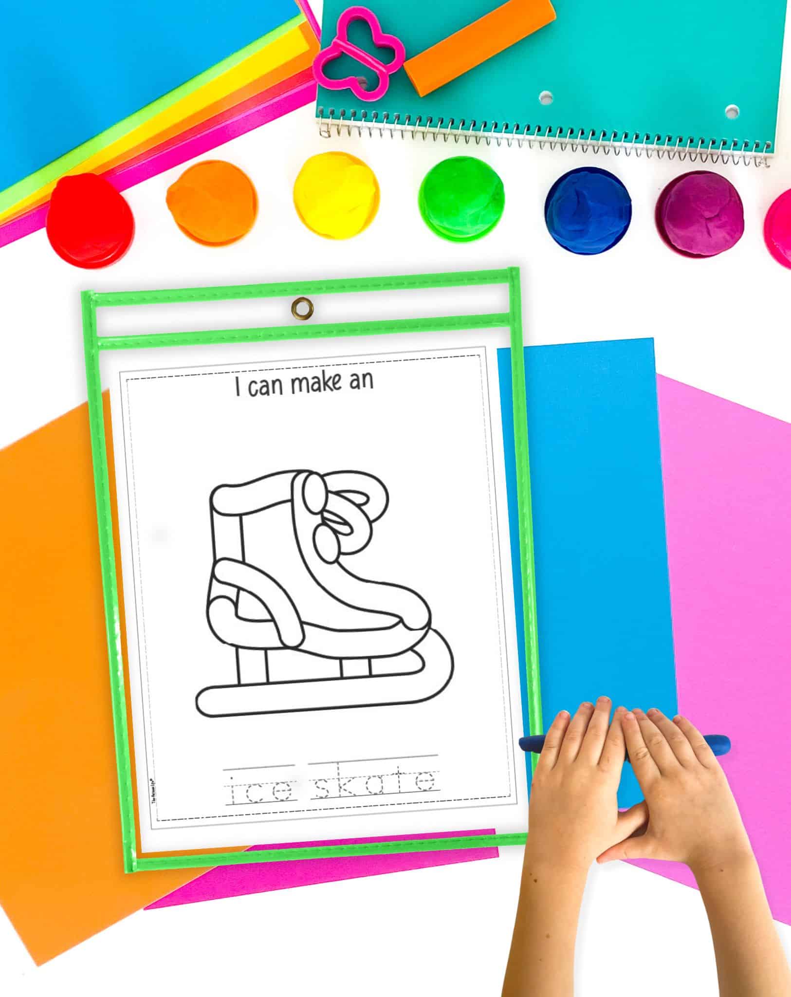 an ice skate play dough mat in a dry erase pocket with a child's hands rolling out a play dough snake