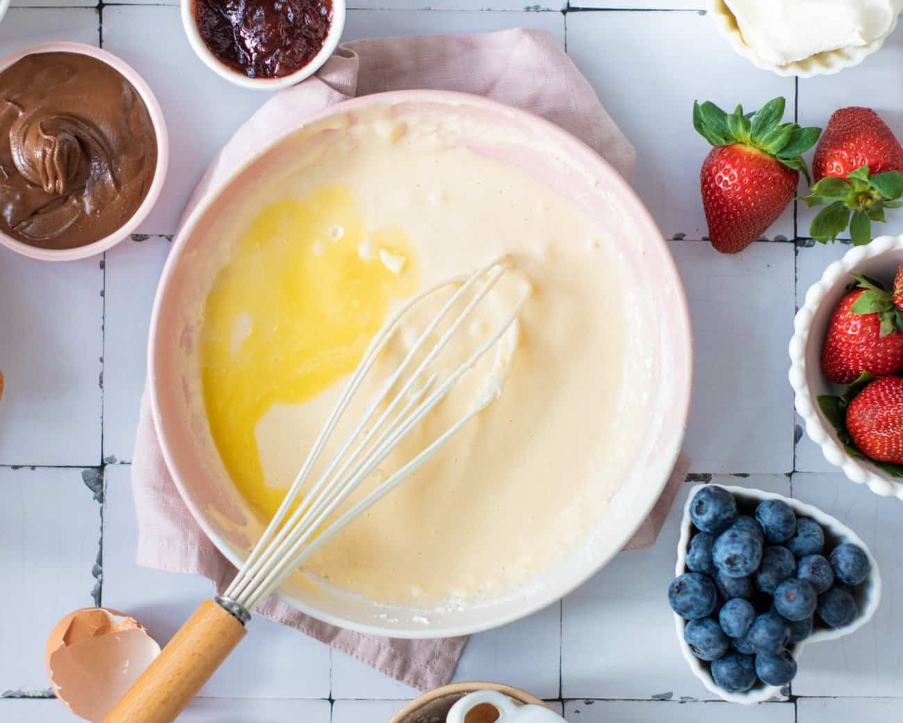 Mixing the wet ingredients to make waffles