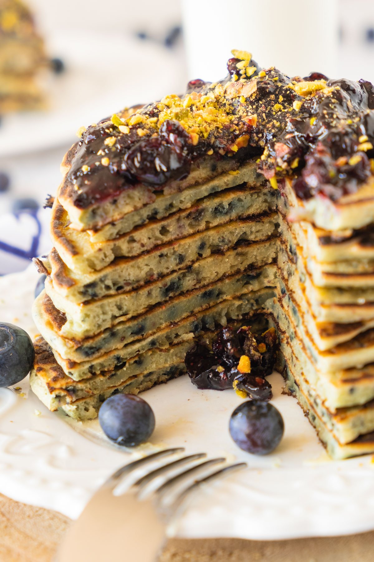 a stack of gluten free blueberry pancakes with homemade blurry jam