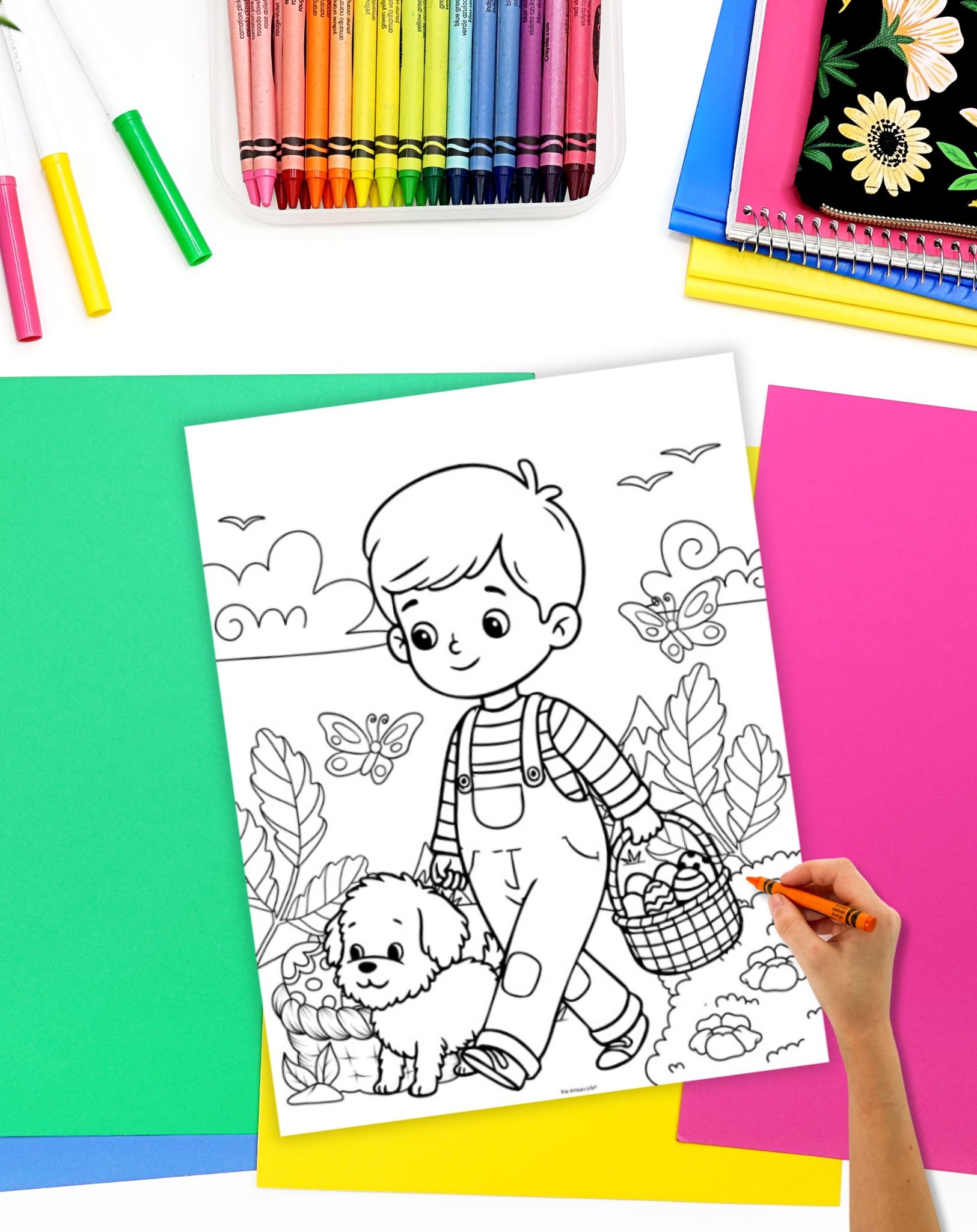 A child in overalls walks with a small dog while carrying a basket of eggs in a spring-themed coloring page, surrounded by leaves and butterflies, with crayons and colorful papers nearby for coloring activities.
