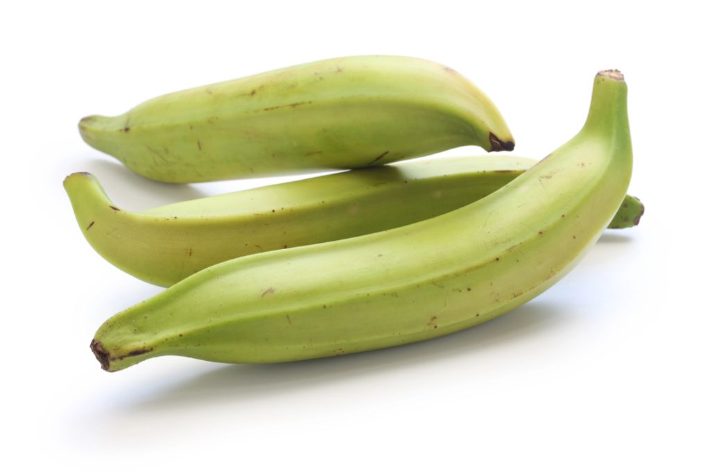 three green plantains on a white background