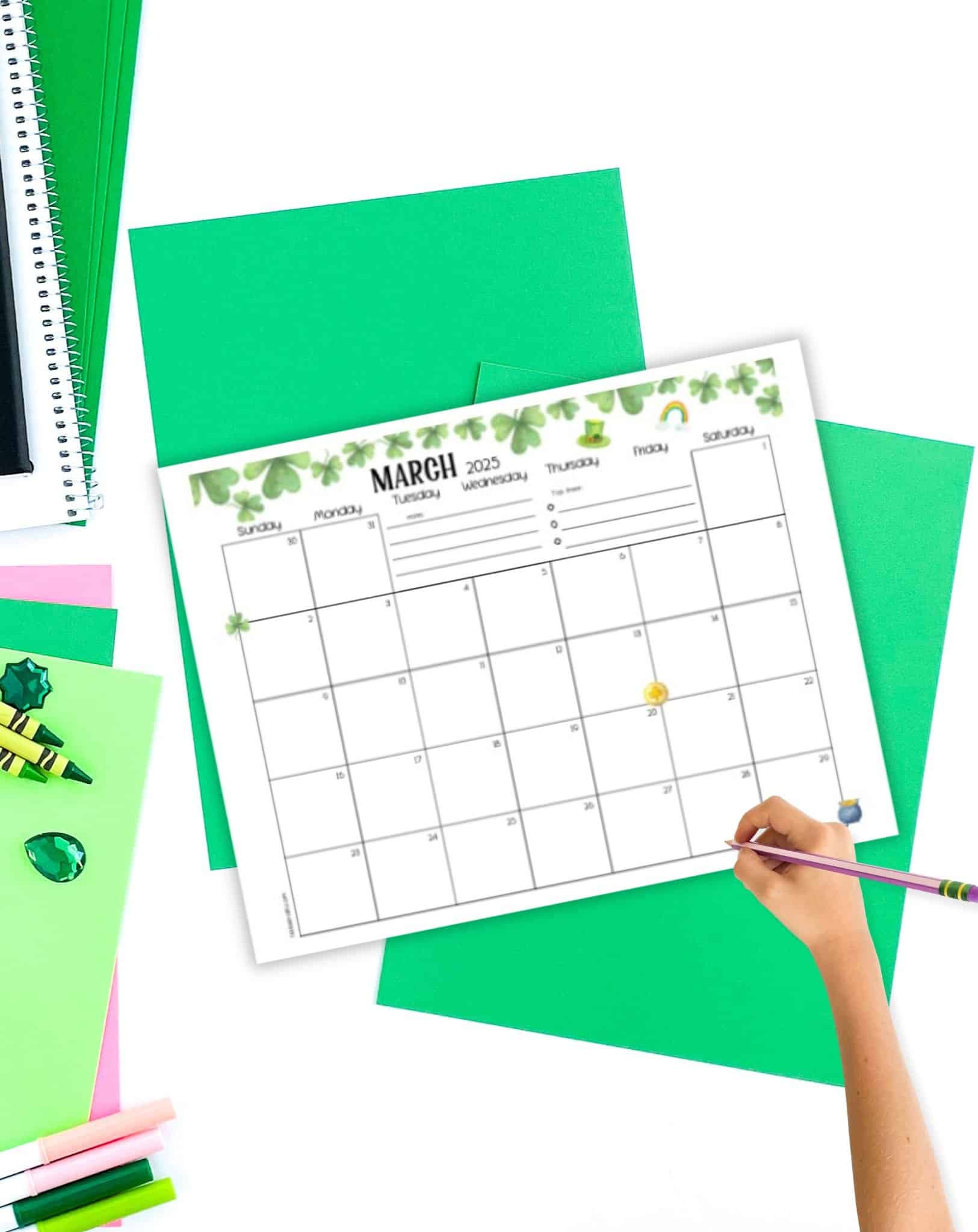 a dated March 2025 calendar on a table with bright green papers