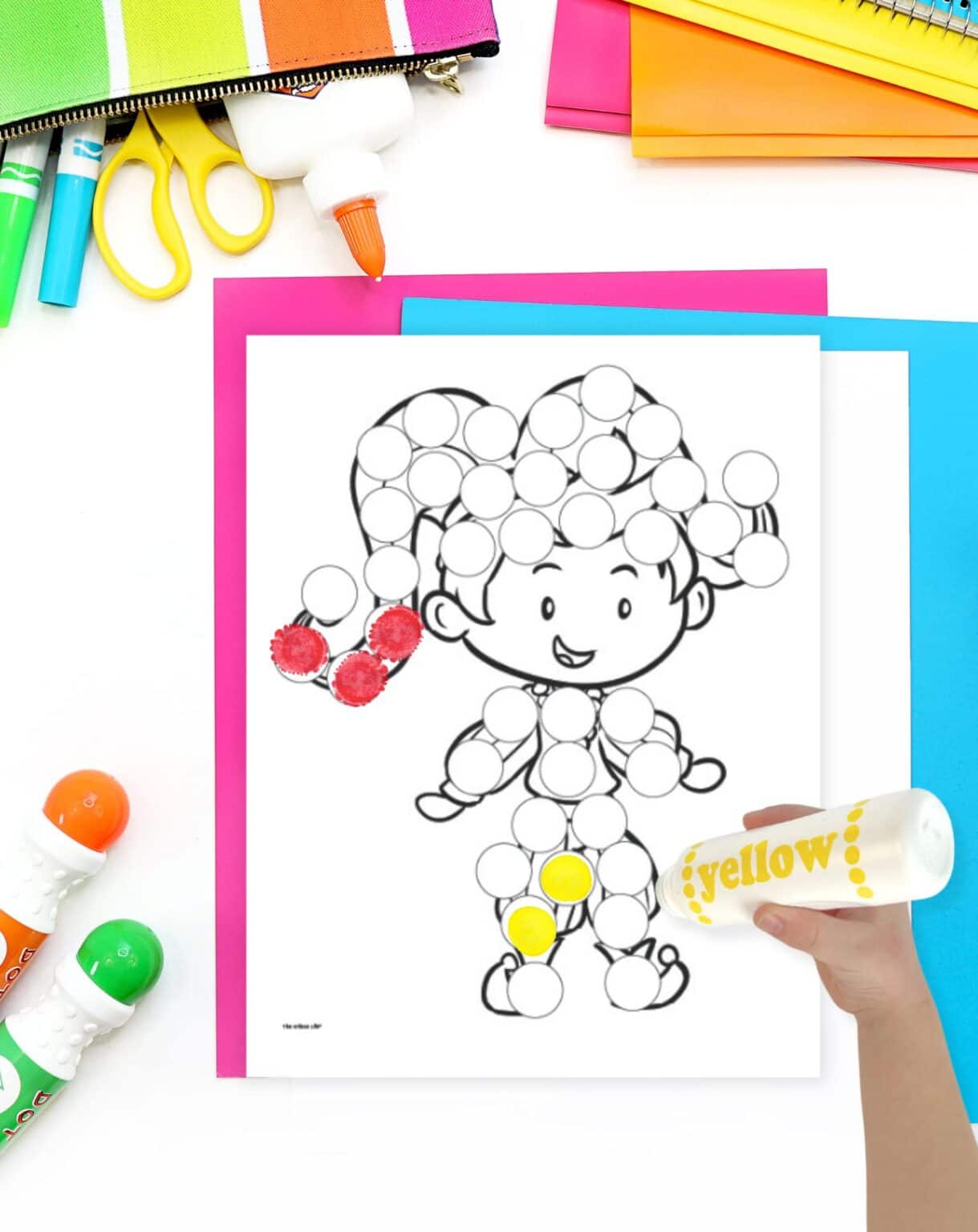 a partially completed dot marker coloring page showing a child dressed as a jester