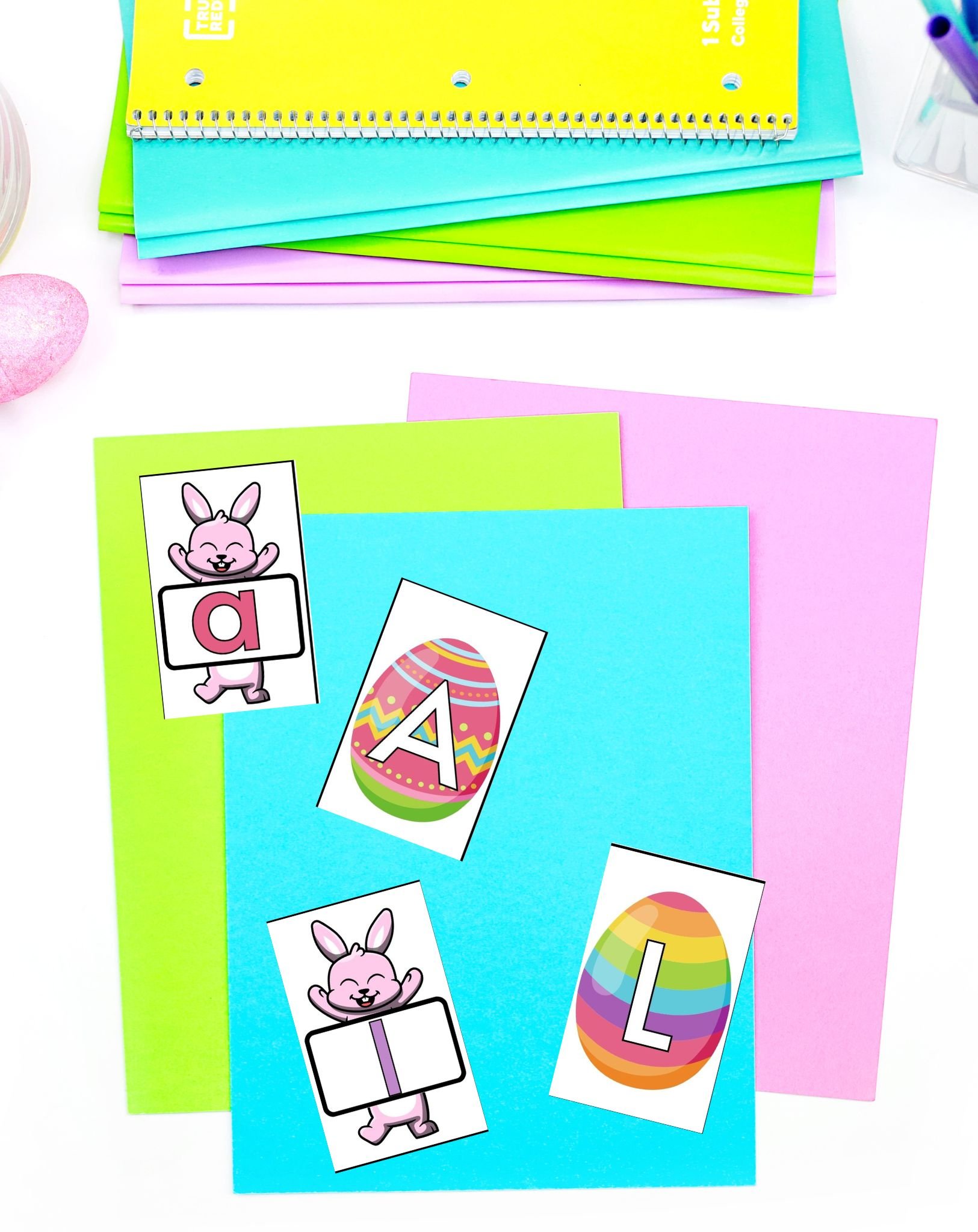 The image features colorful paper sheets with Easter-themed letter cards, including a bunny and decorated eggs, designed for preschool alphabet activities and learning tasks related to Easter.
