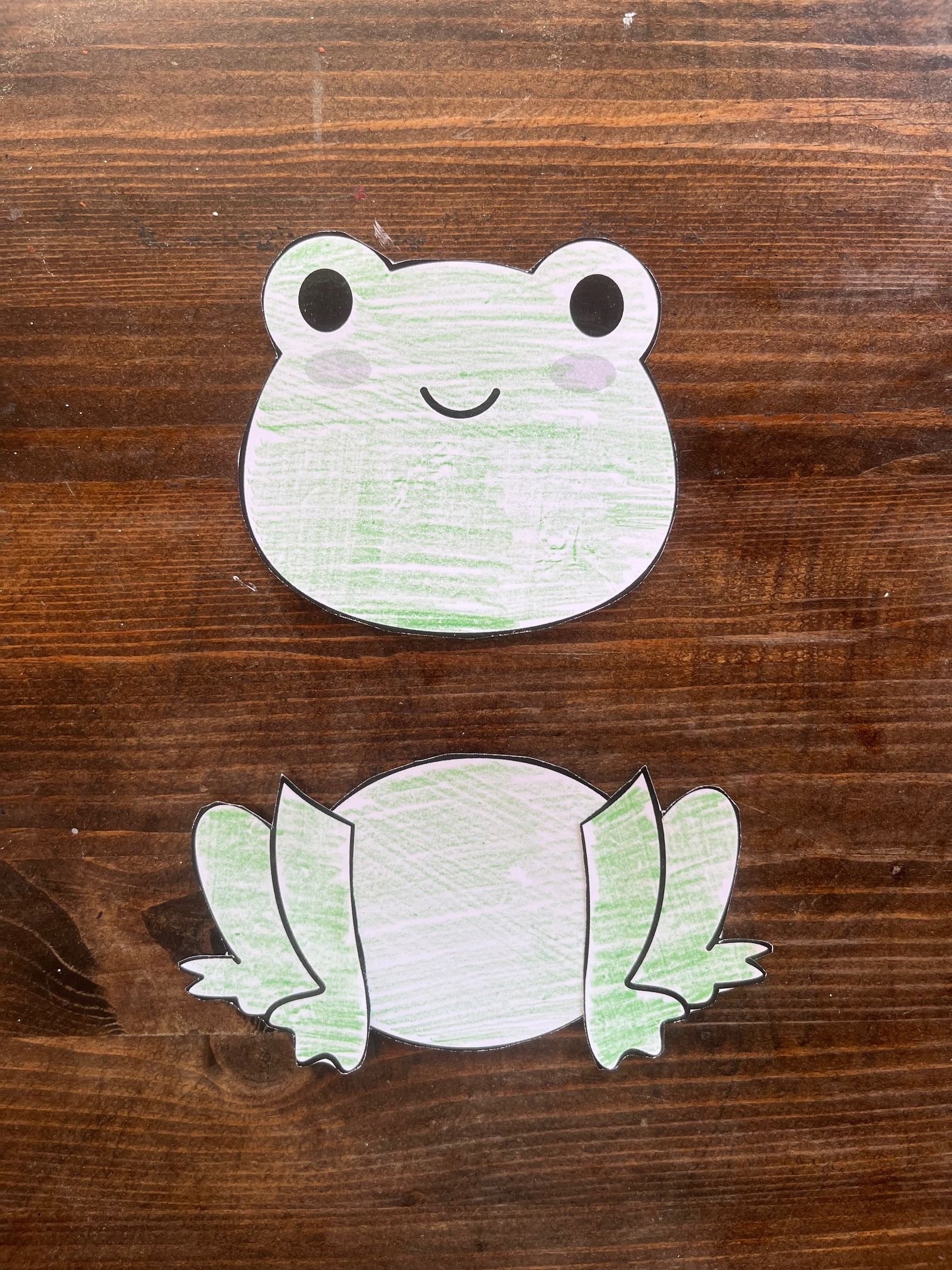A two-part paper frog craft showing the head and body, designed for kids' activities related to frogs and amphibians, suitable for preschool and kindergarten art projects.
