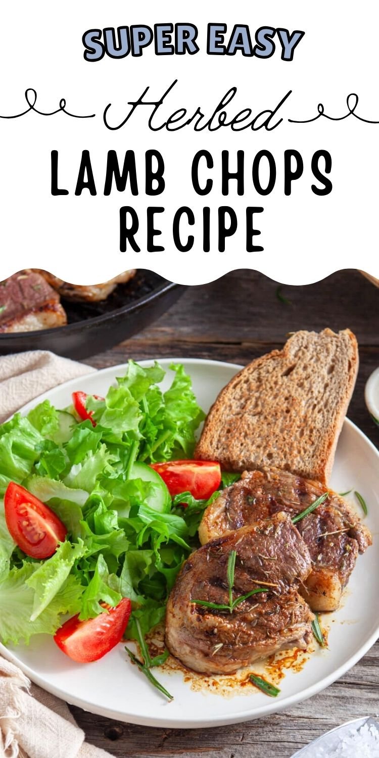 A plate of oven-roasted lamb chops garnished with herbs, served alongside a fresh salad of lettuce and tomatoes, with slices of bread in the background.
