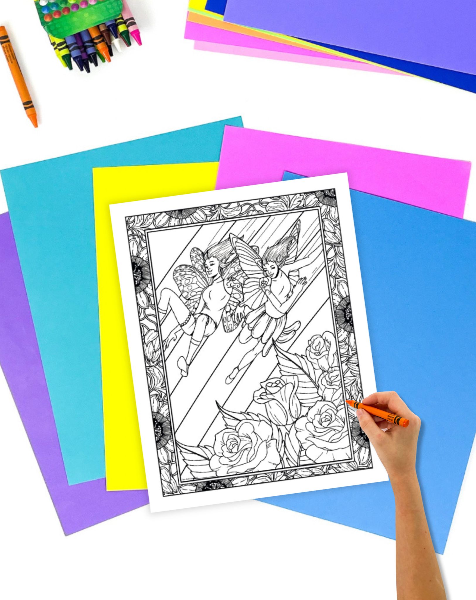 a hadn't coloring a detailed coloring page showing fairies with butterfly wings and roses