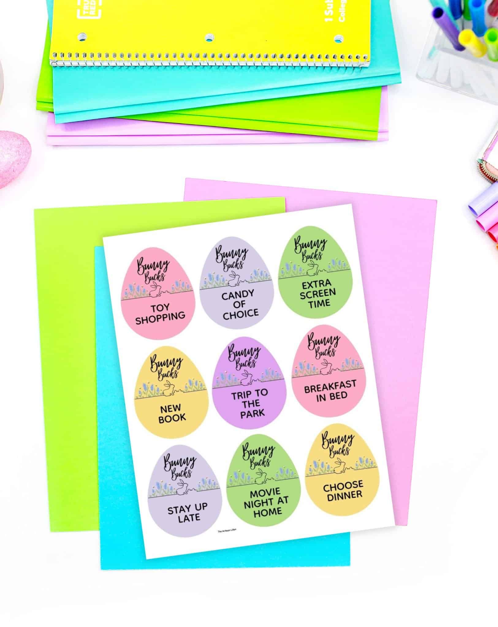 A page of Easter coupons on a table with pastel papers