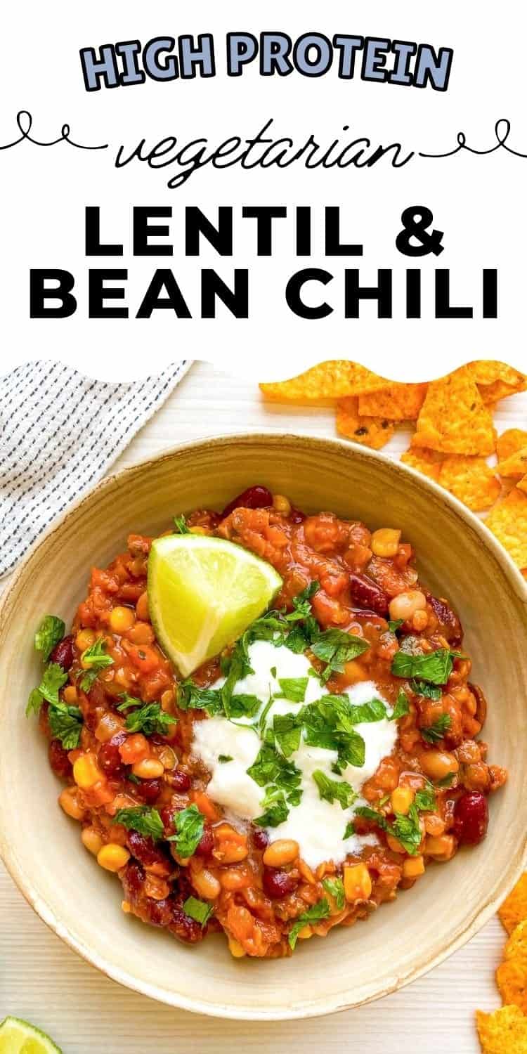 A bowl of colorful vegetarian chili topped with fresh cilantro, a dollop of sour cream, and lime wedges, accompanied by tortilla chips, showcasing an easy vegetarian chili recipe ideal for nutritious dinners or filling lunches.
