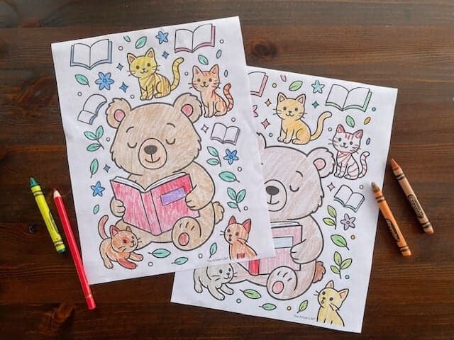 two of the same coloring page showing a bear reading with cats and plants
