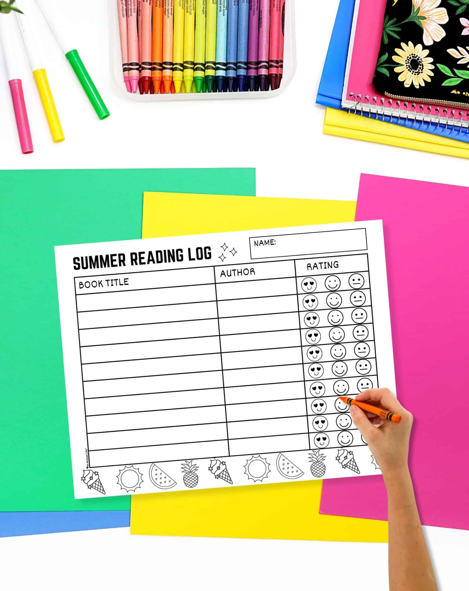 a hand holding an orange crayon over a summer reading log tracker printable